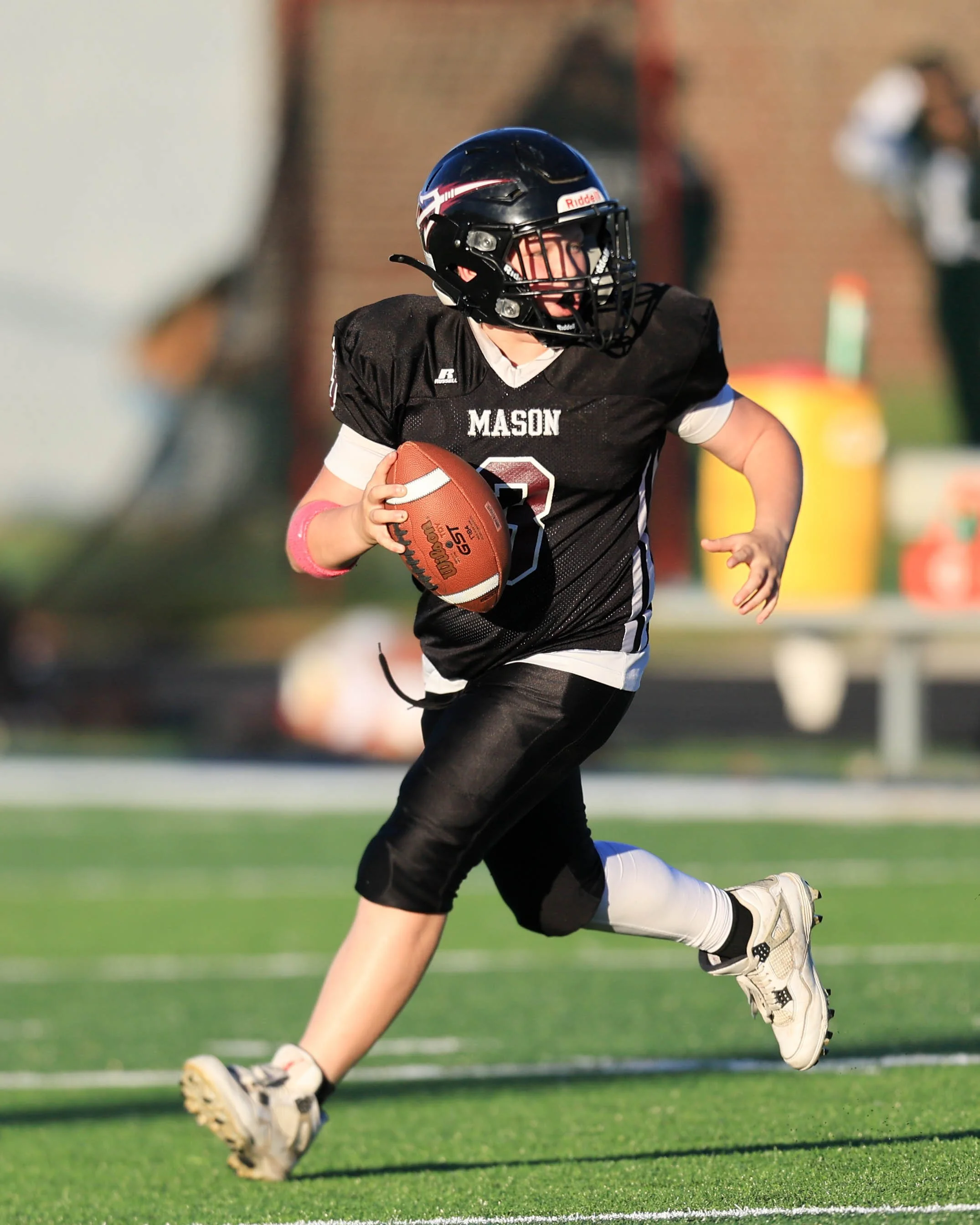Mason #3 rolls out to pass the ball