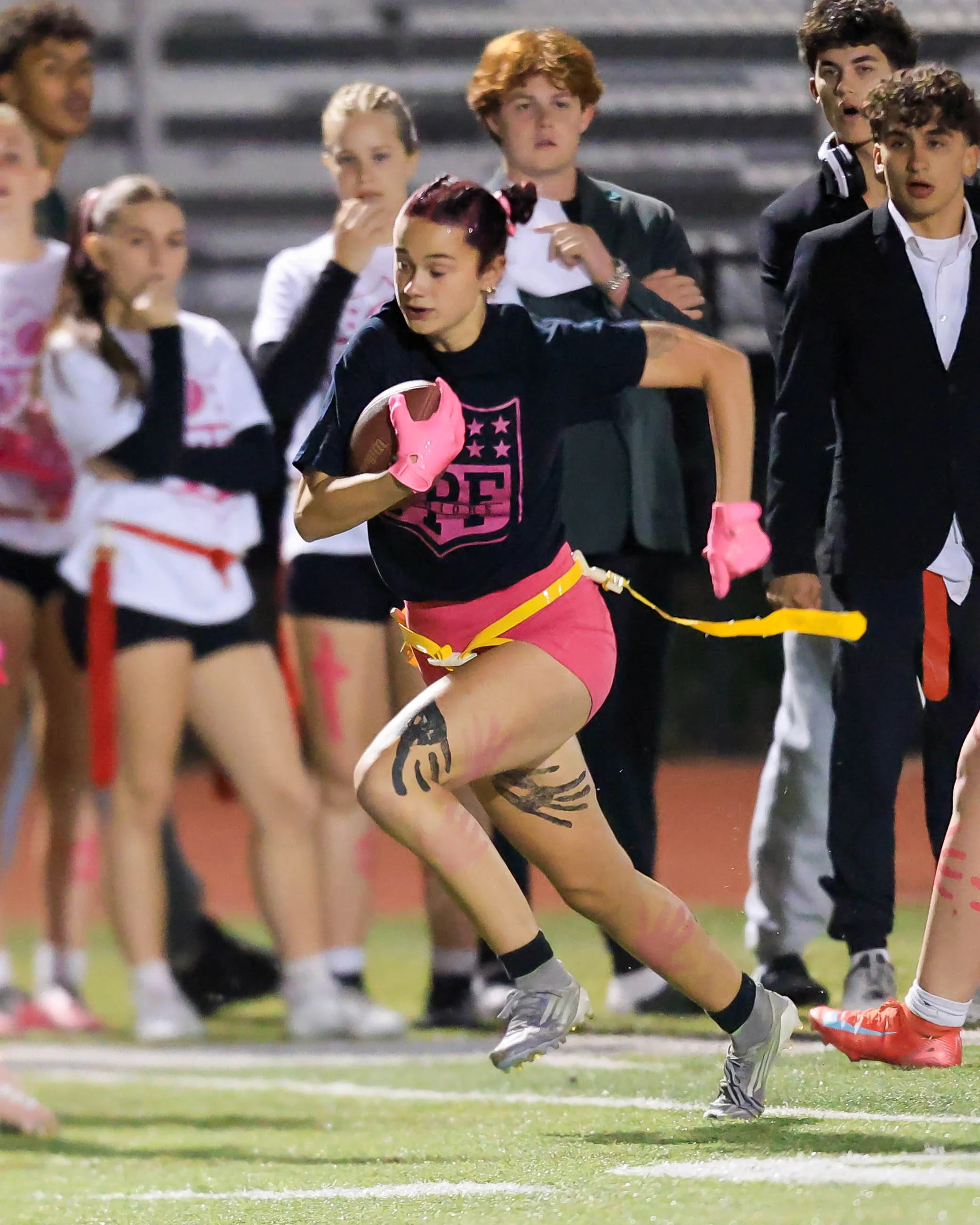 Senior runs with the ball 