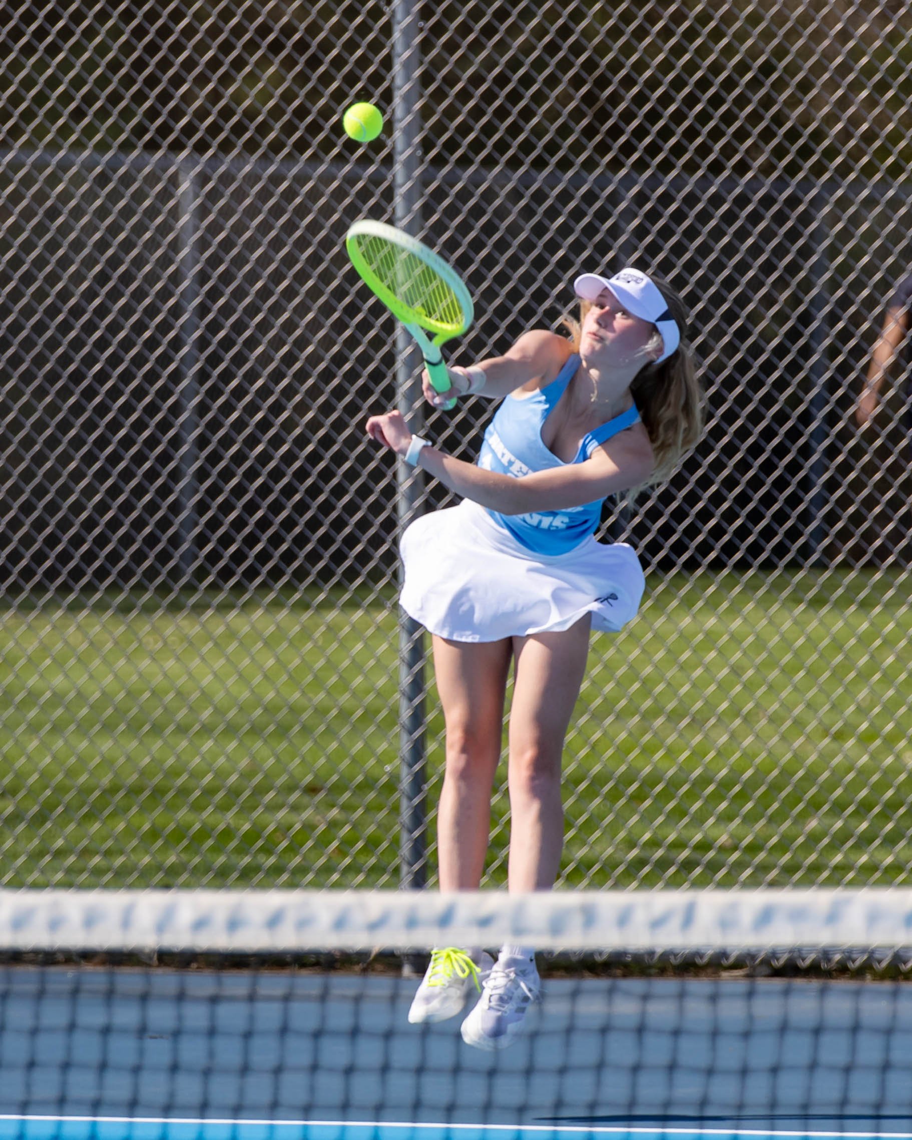 Waterford United player serves the ball