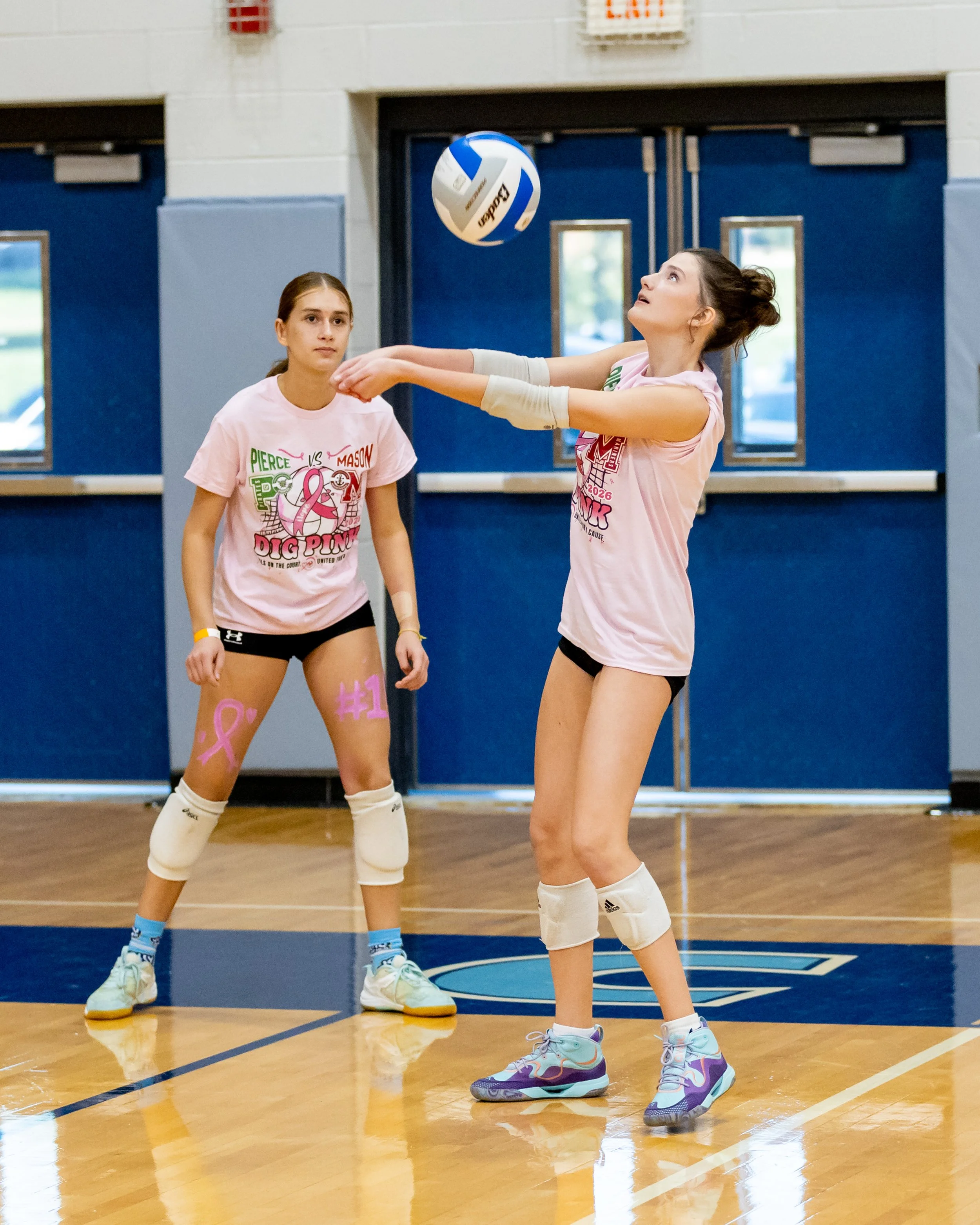 Mason player hits the ball
