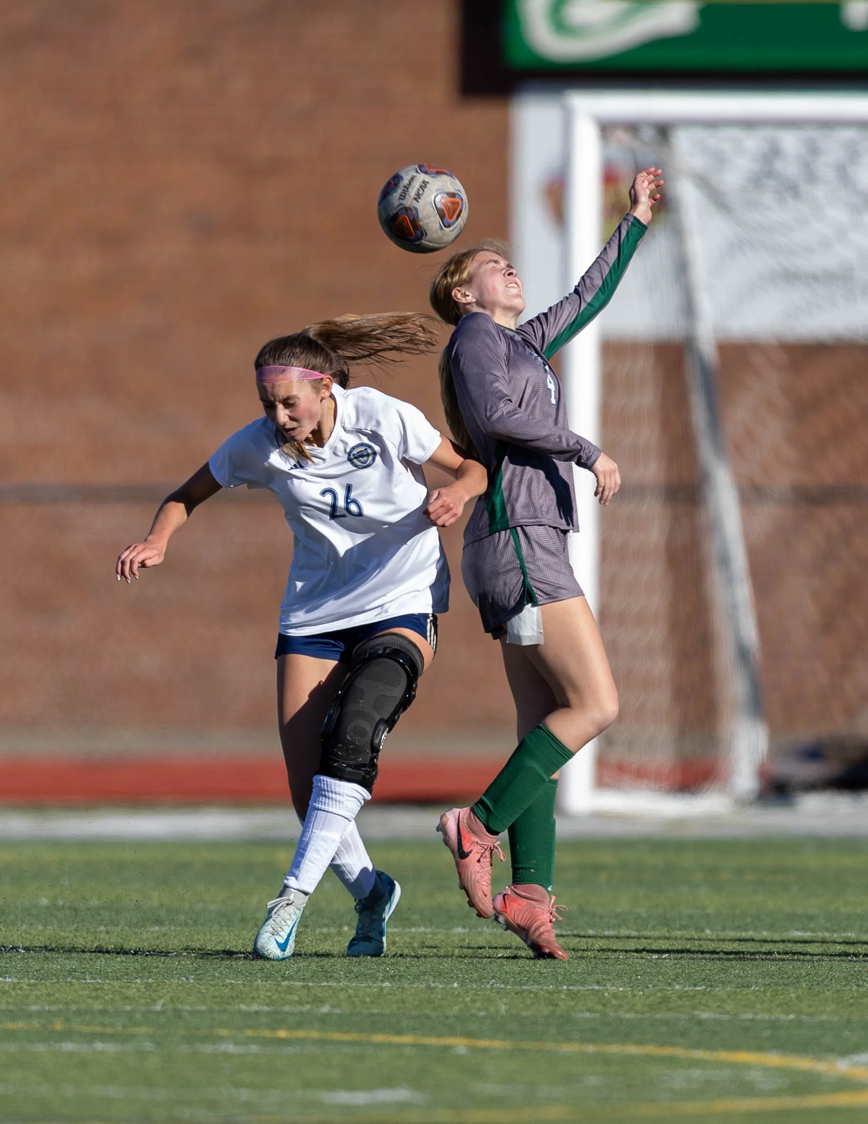 #4 heads the ball