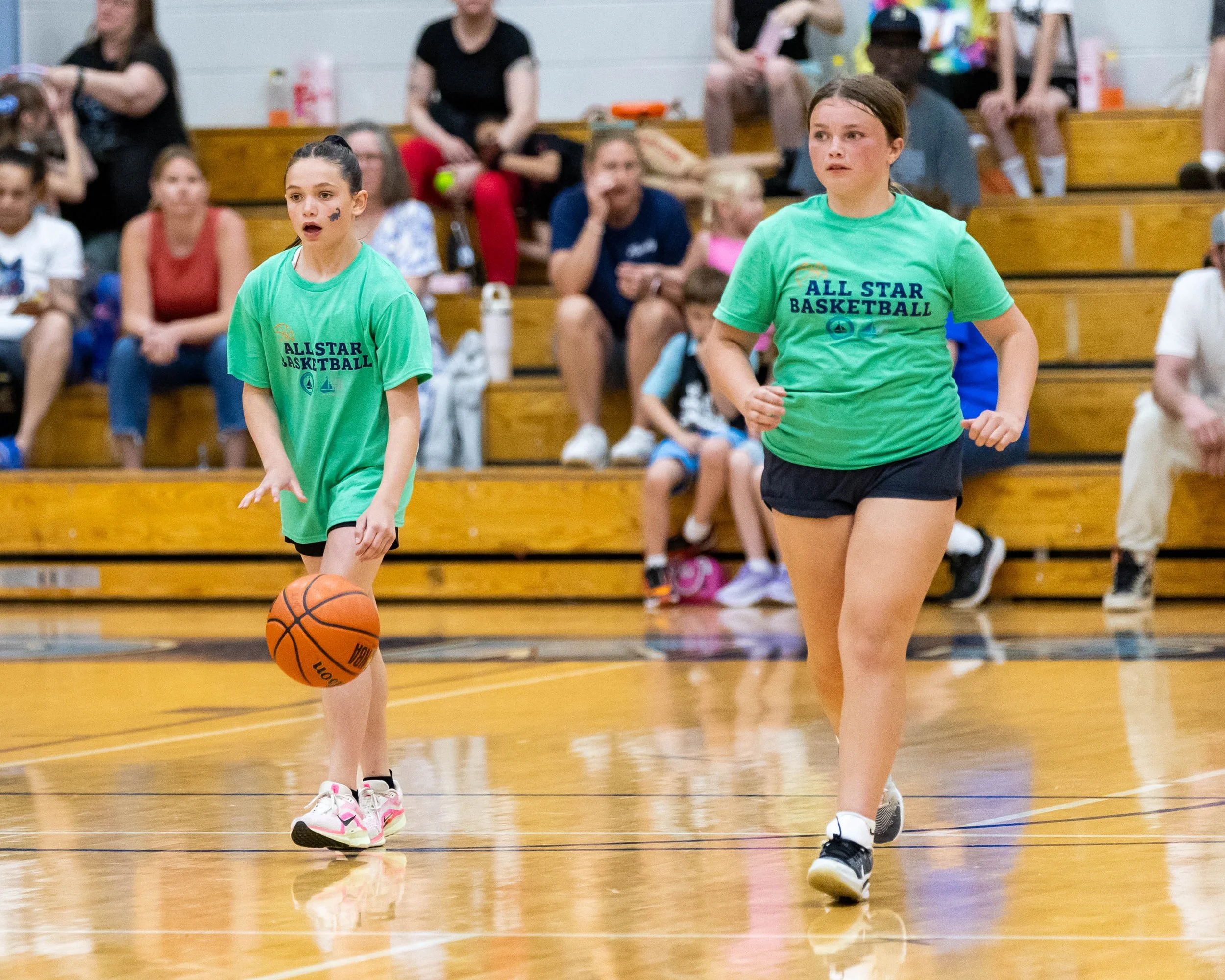 South girl with teammate