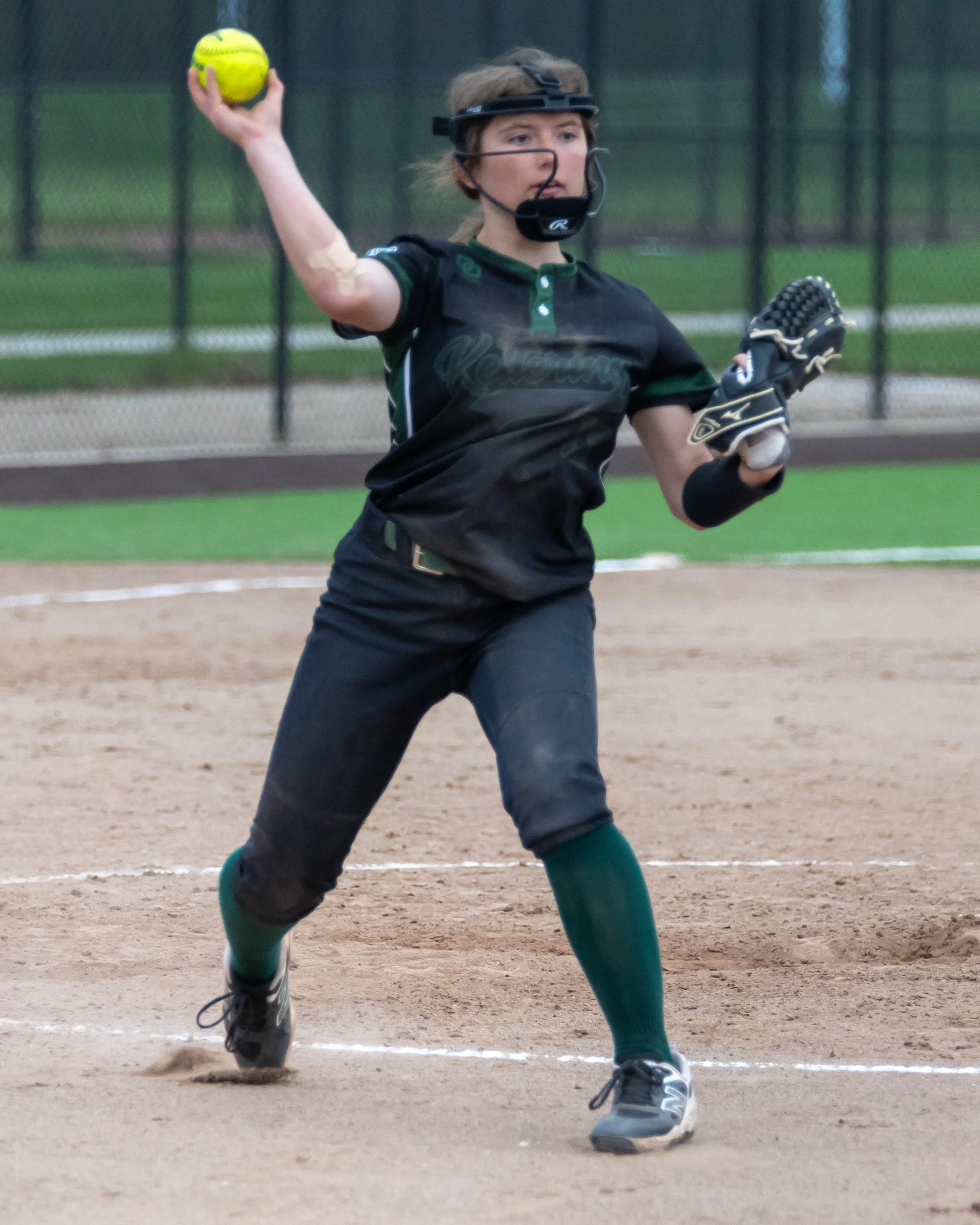 Kettering pitcher throws to first base