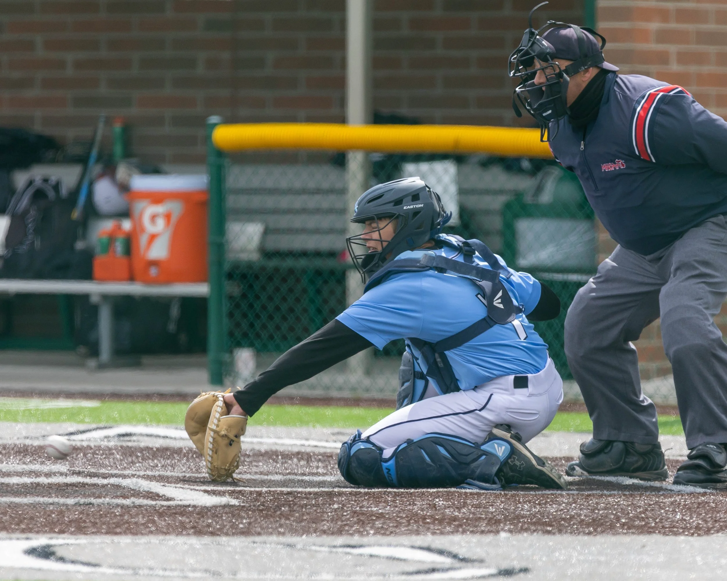 Mott catcher stops the ball