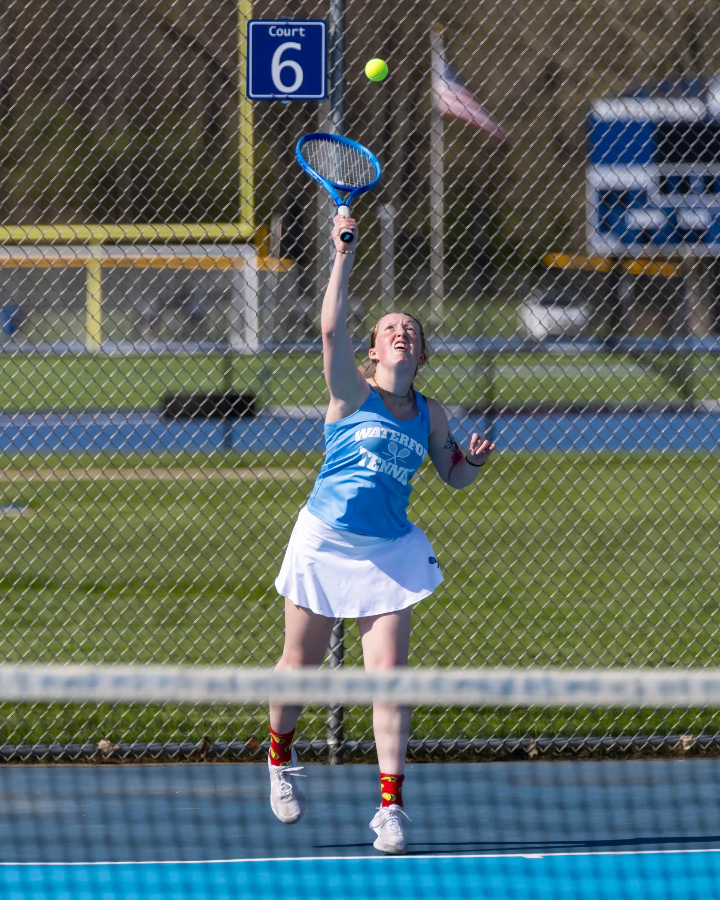 Waterford United player serves the ball