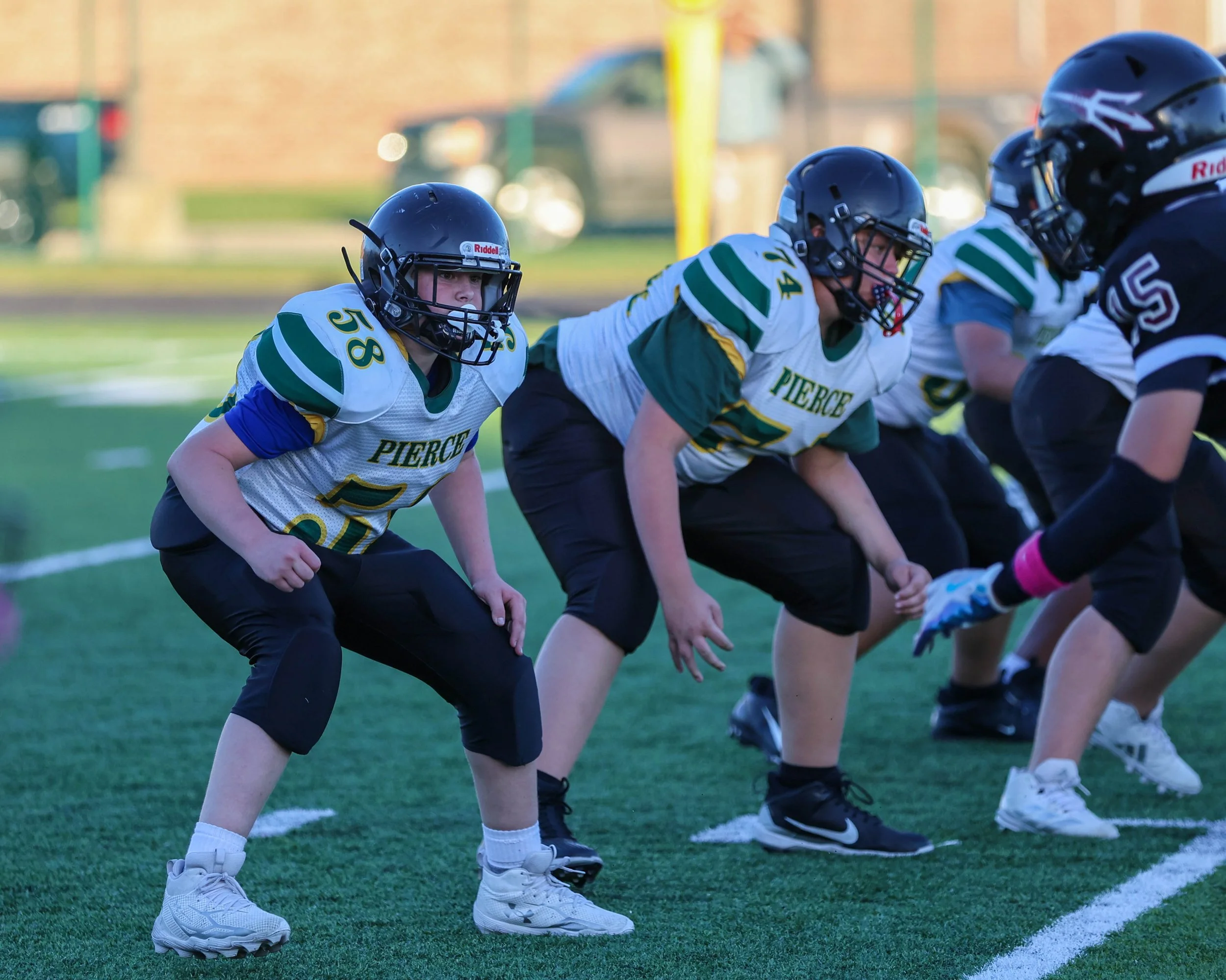 Pierce #58 and #74 on the offense line