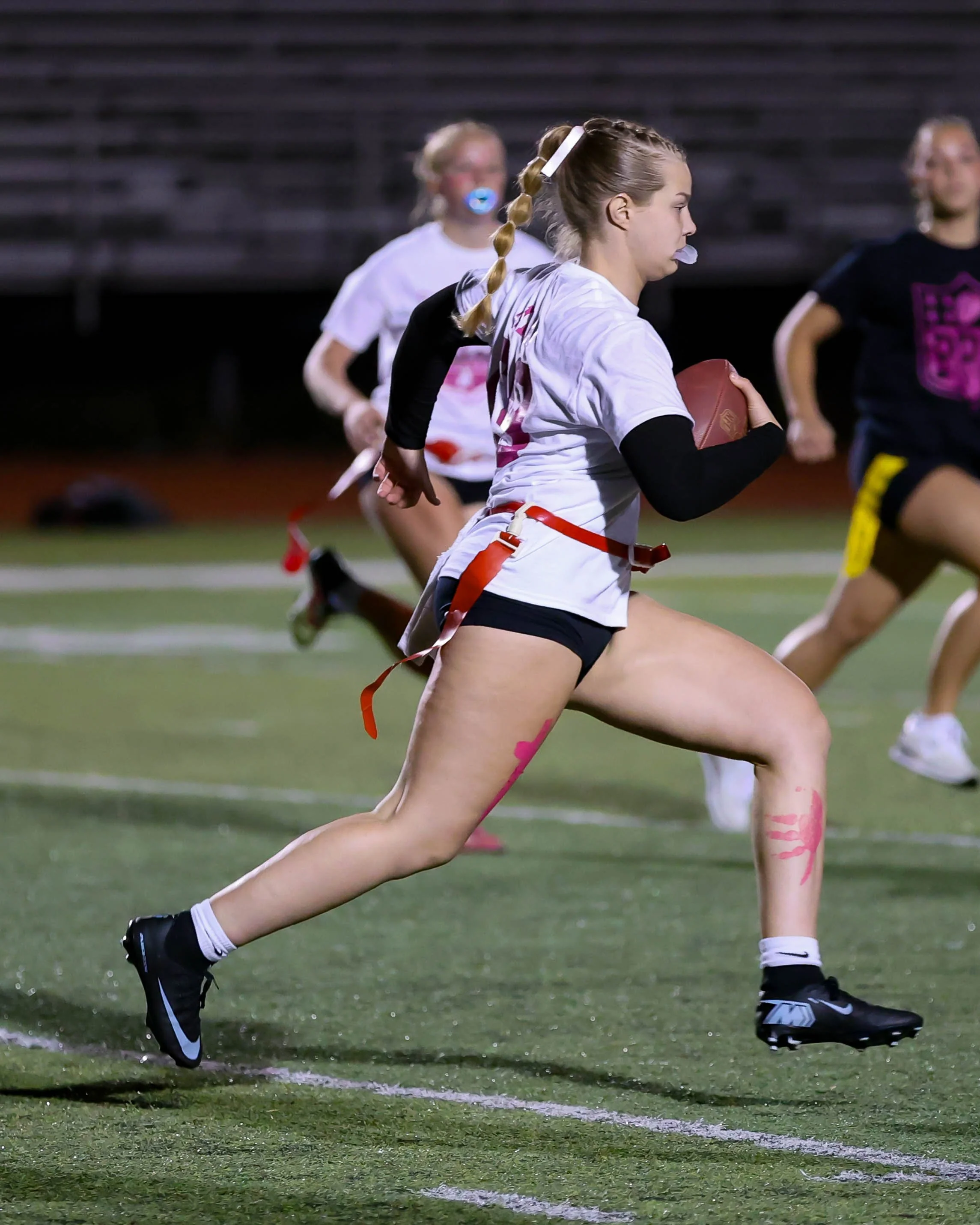 Junior quarterback running with the ball
