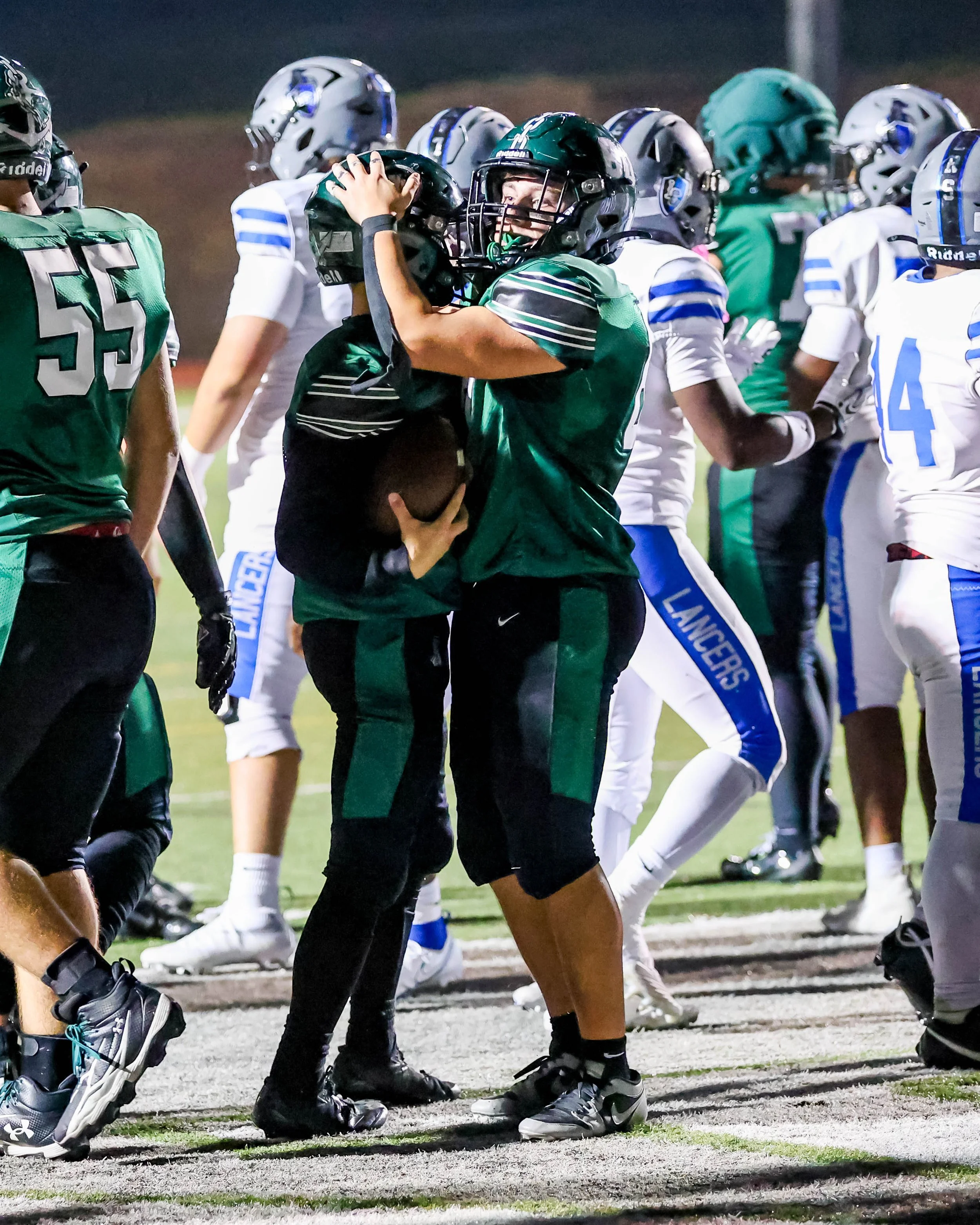 WK center celebrates with the running back