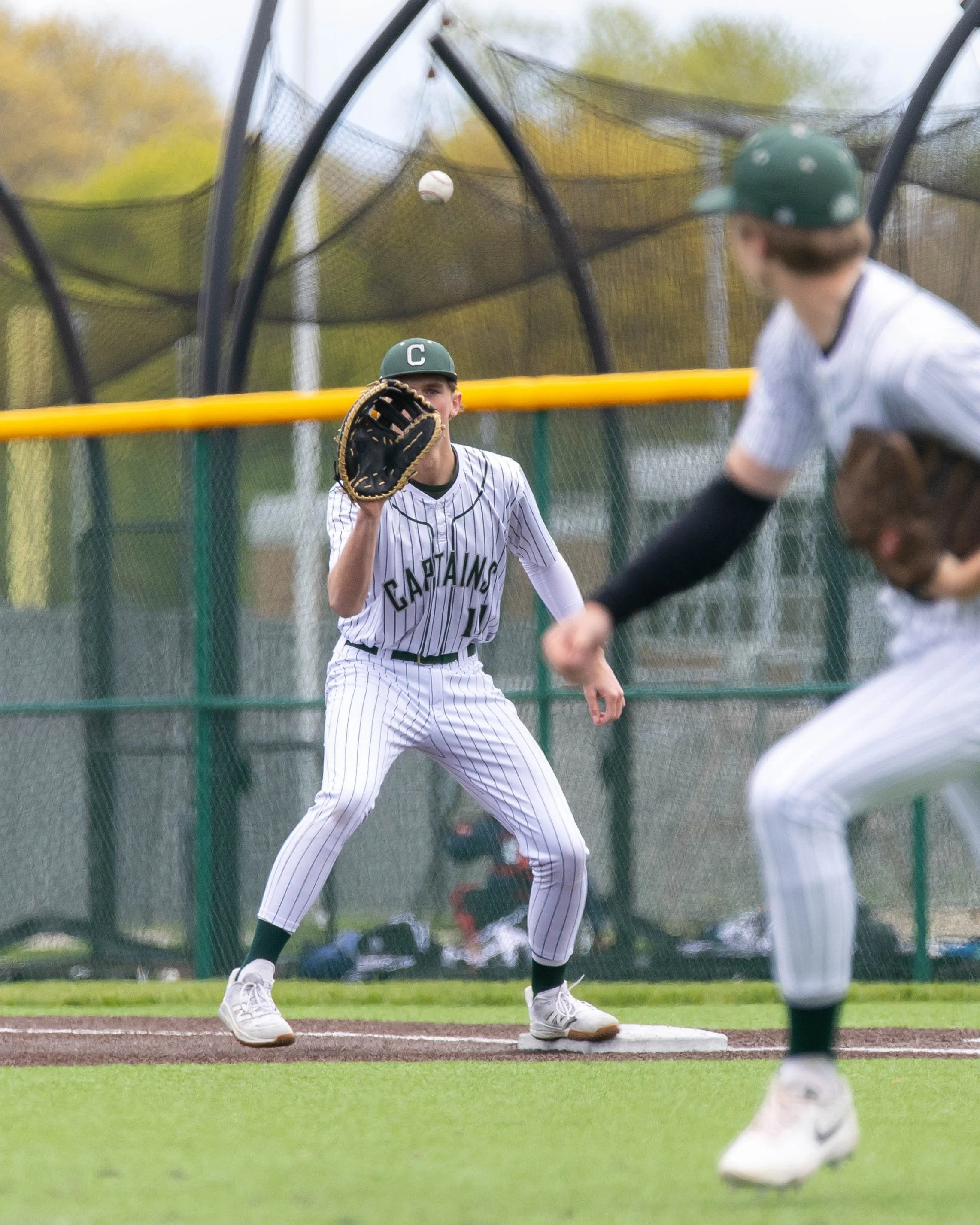Kettering #11 waits for the ball at 1st base