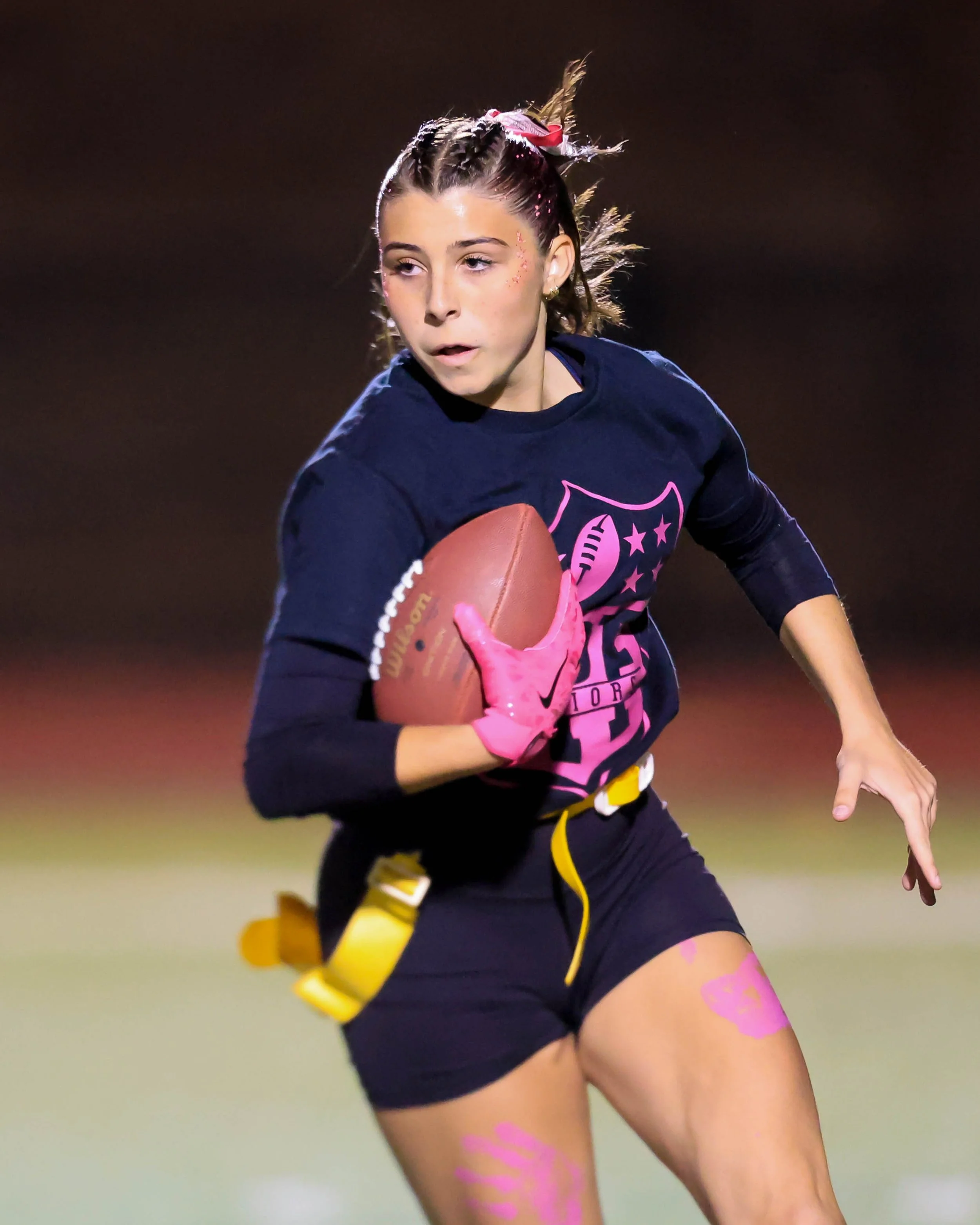 Senior running with the ball