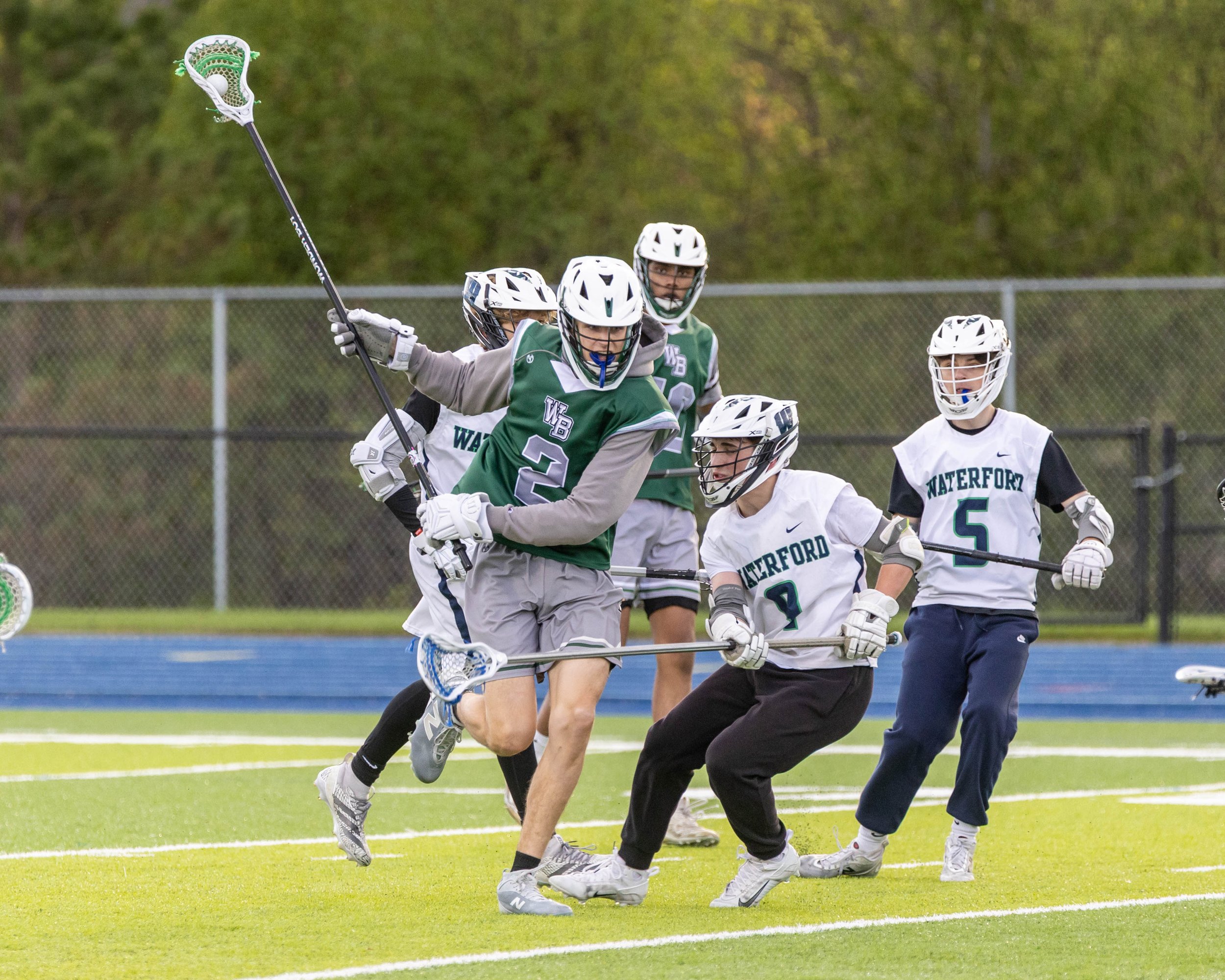 Waterford United players surround a West Bloomfield player