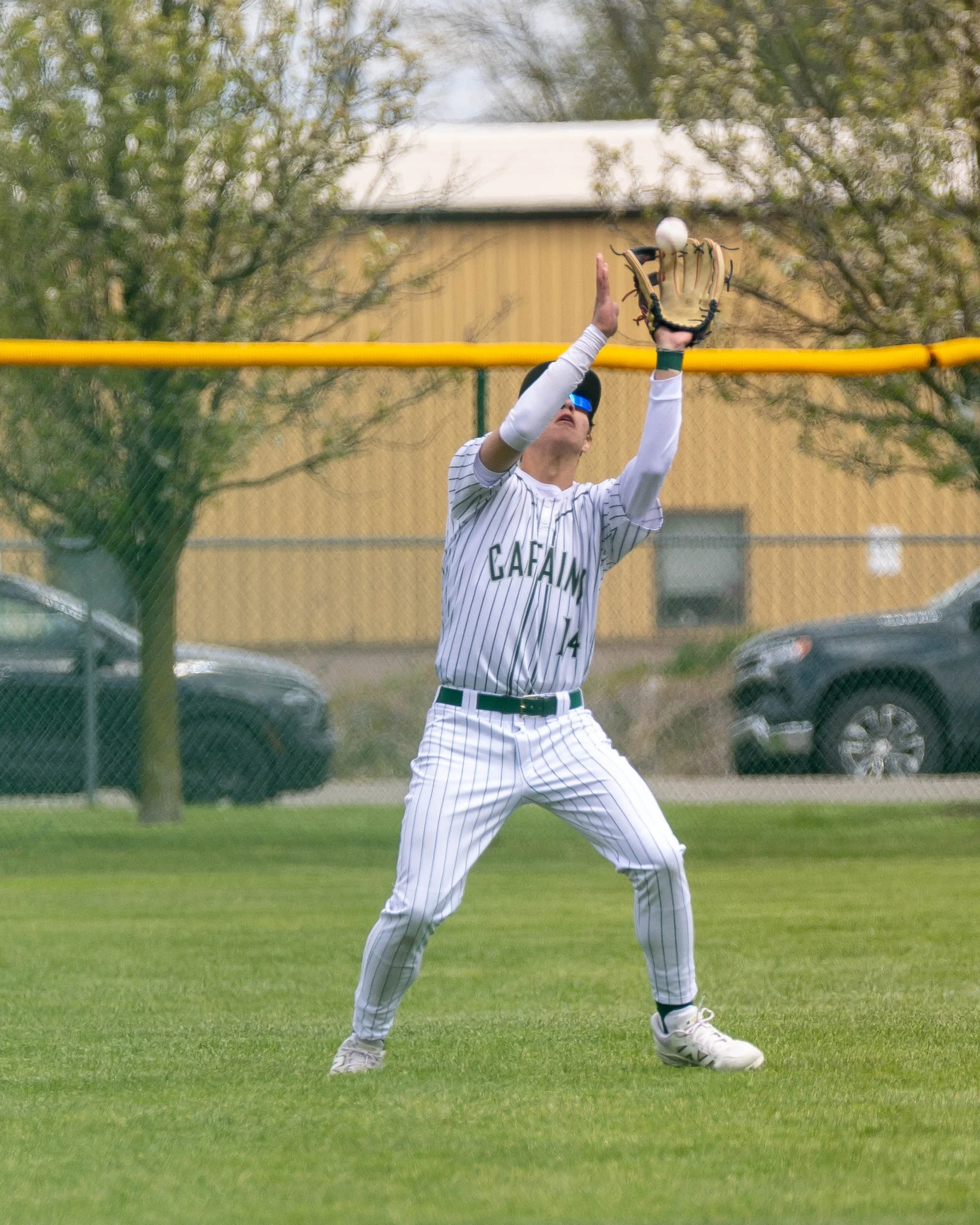 Kettering #14 catches a pop fly