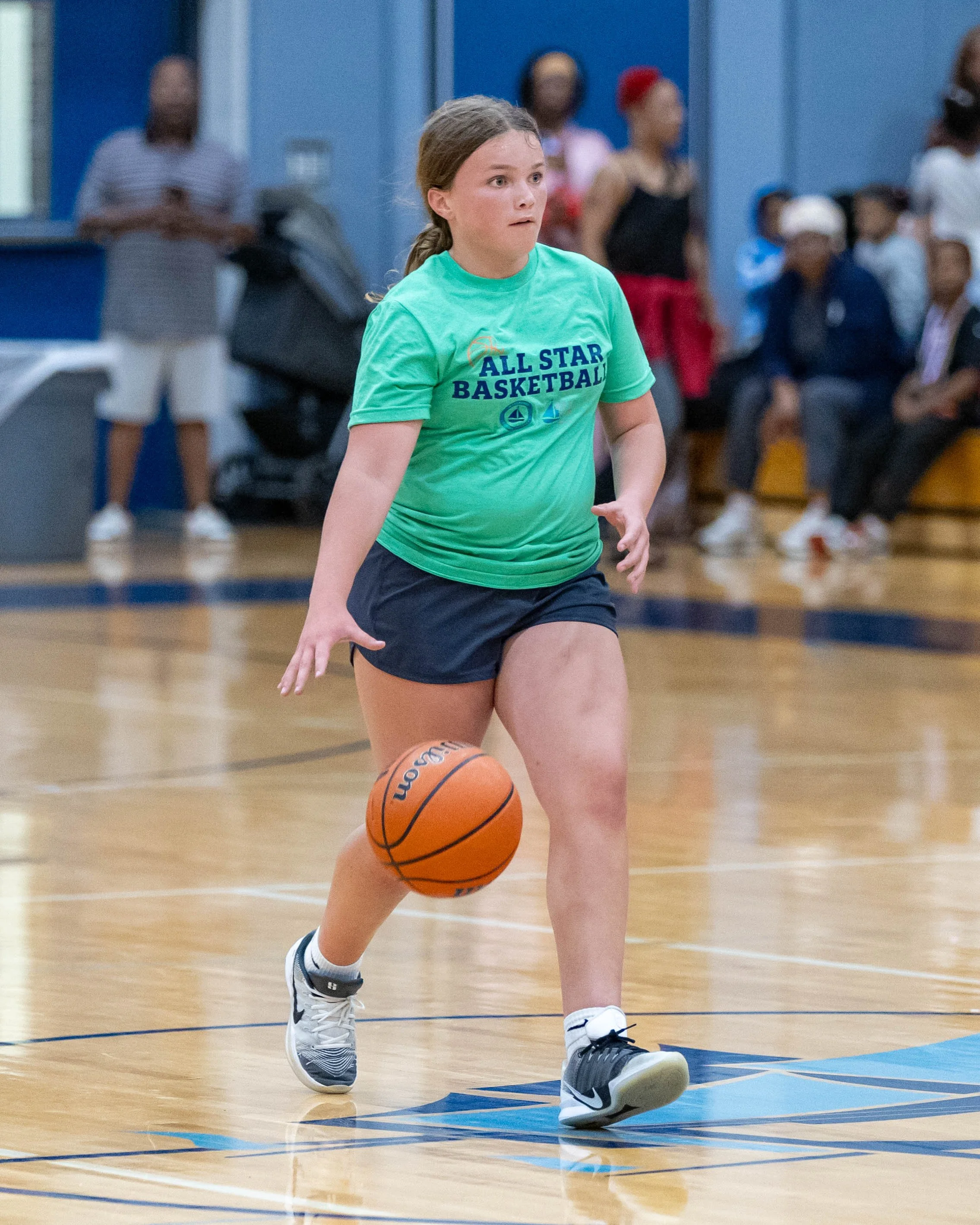 South girl dribbles the ball up the court