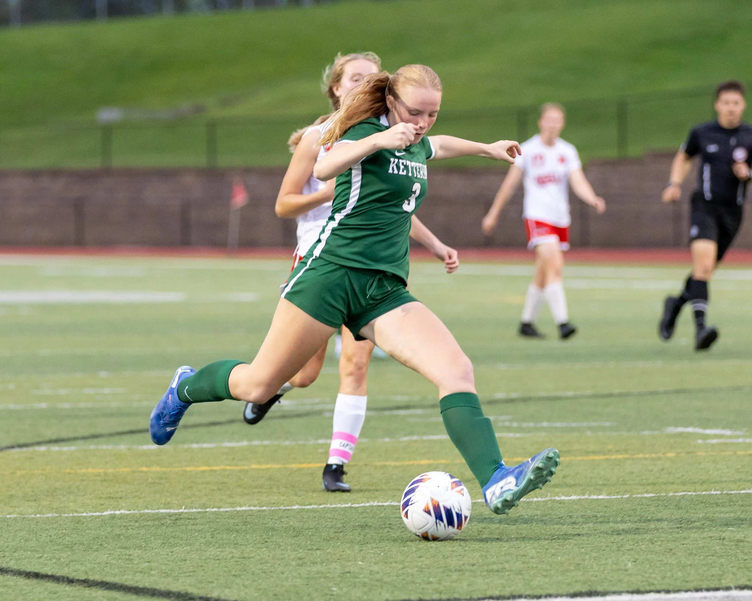 #3 goes to kick the ball