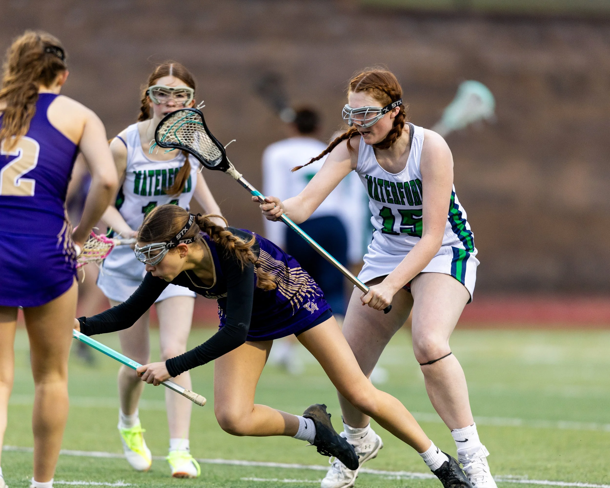 #15 watches the St Catherine player go fall