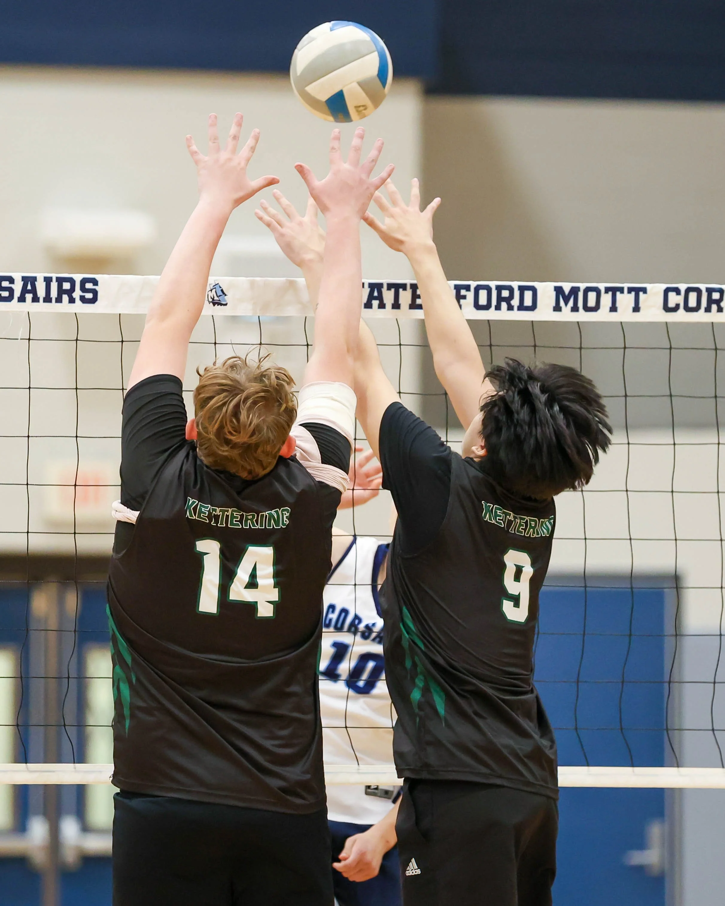 Kettering #14 and #9 try to block the ball