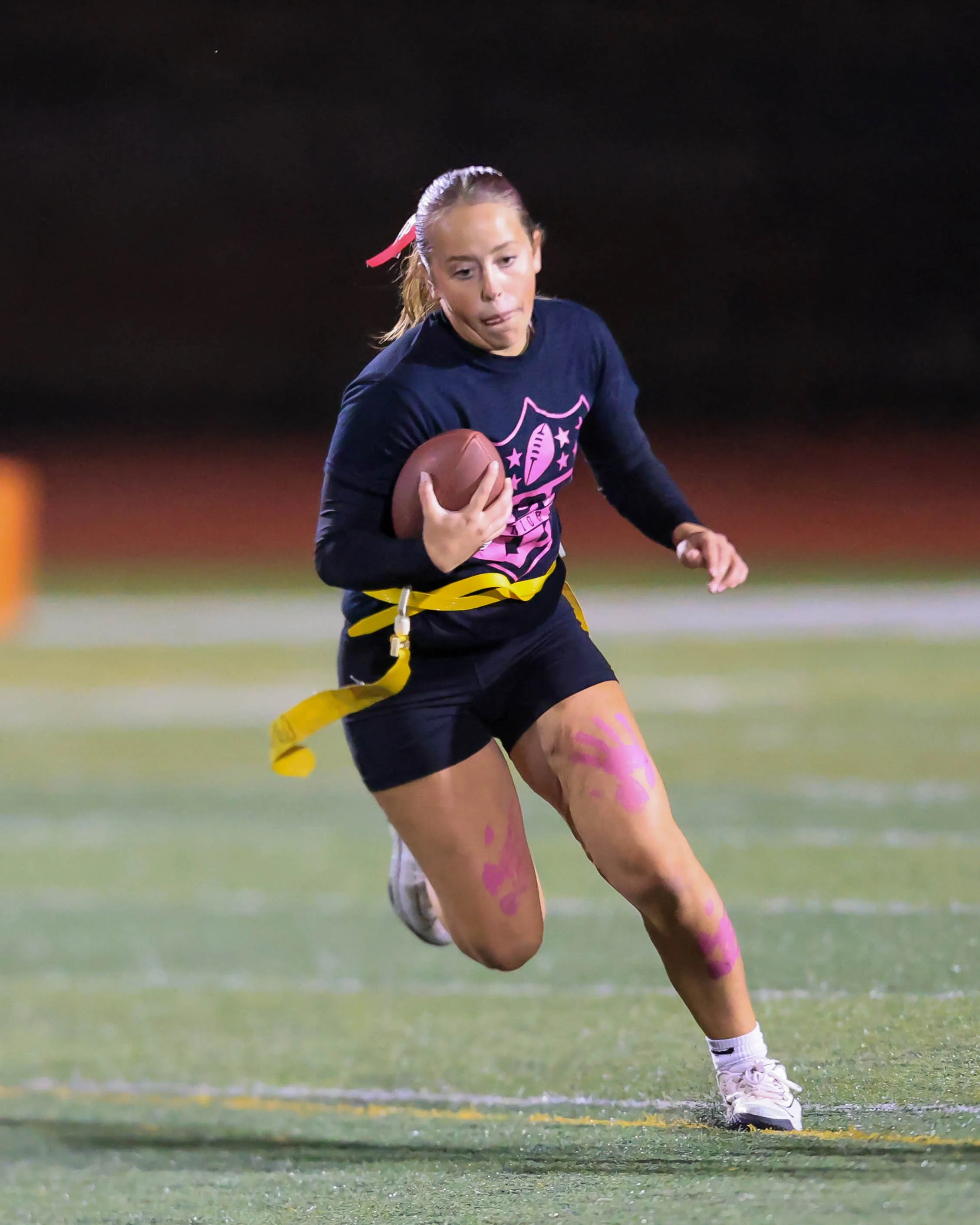 Senior quarterback runs with the ball