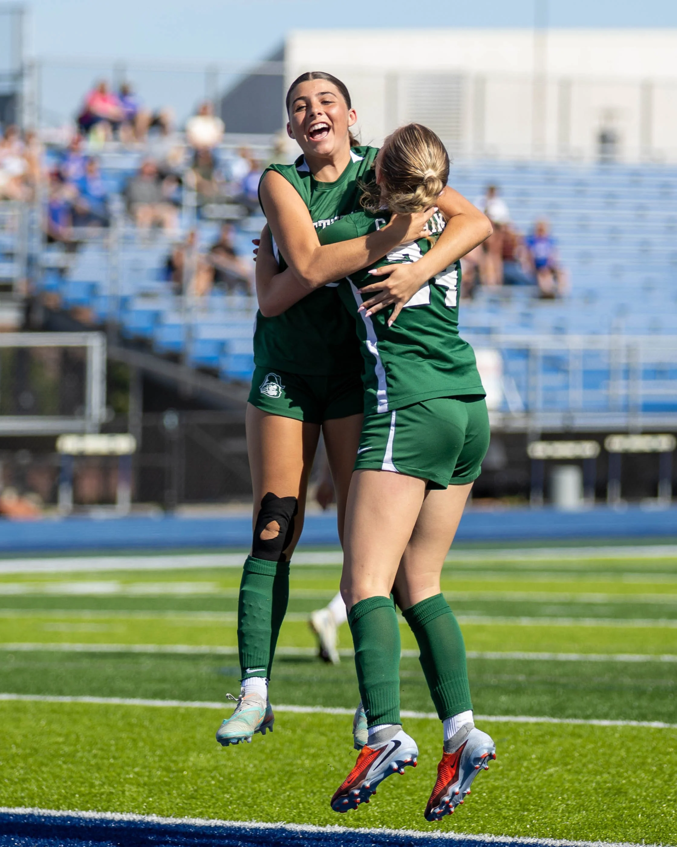 #15 and #24 celebrate the goal