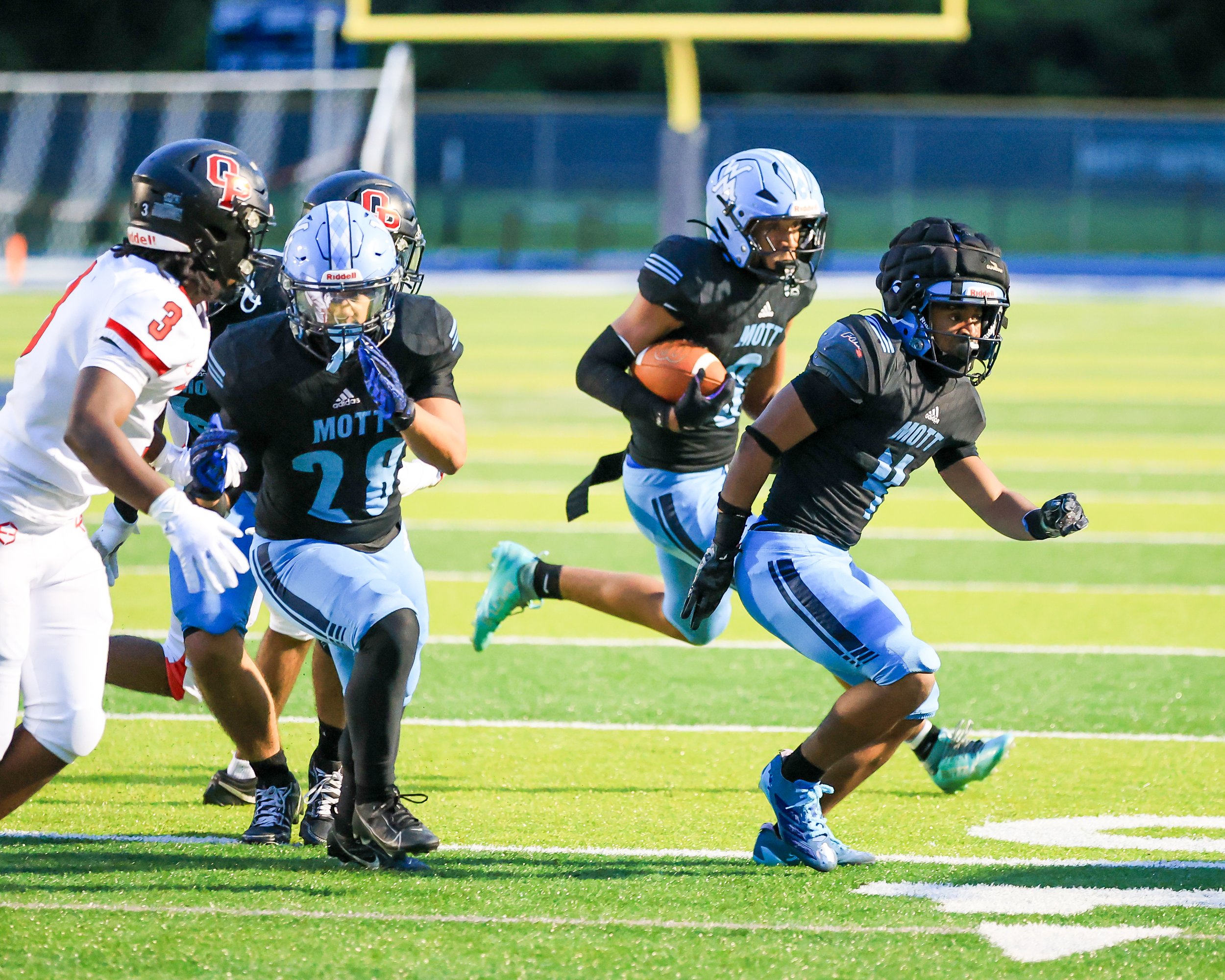 WK #8 carries the ball around the corner