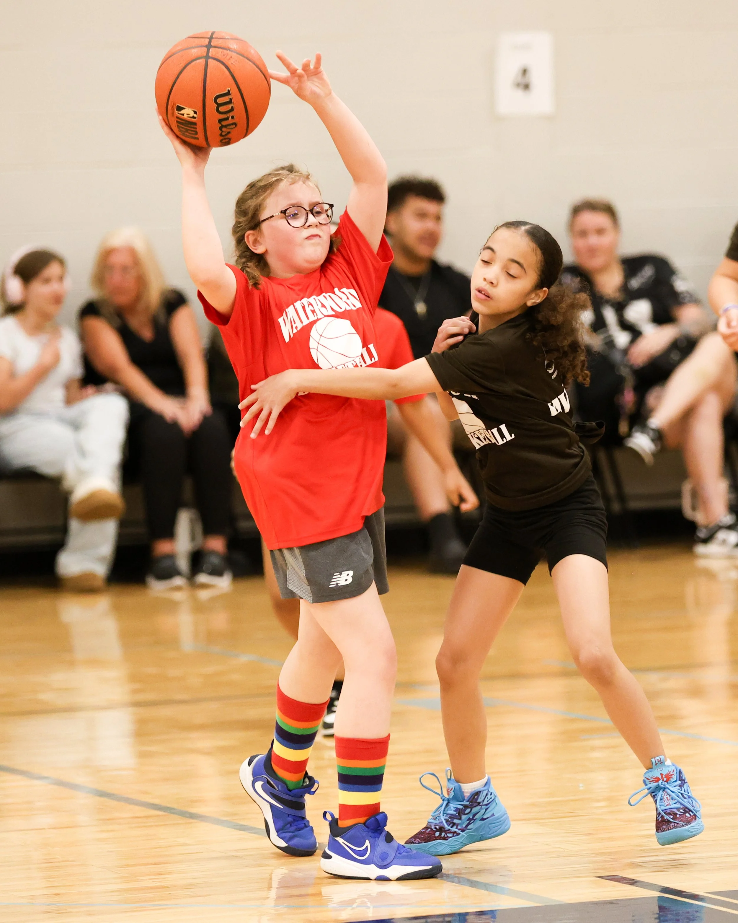 Houghton girl holds the ball being guarded by Haviland girl