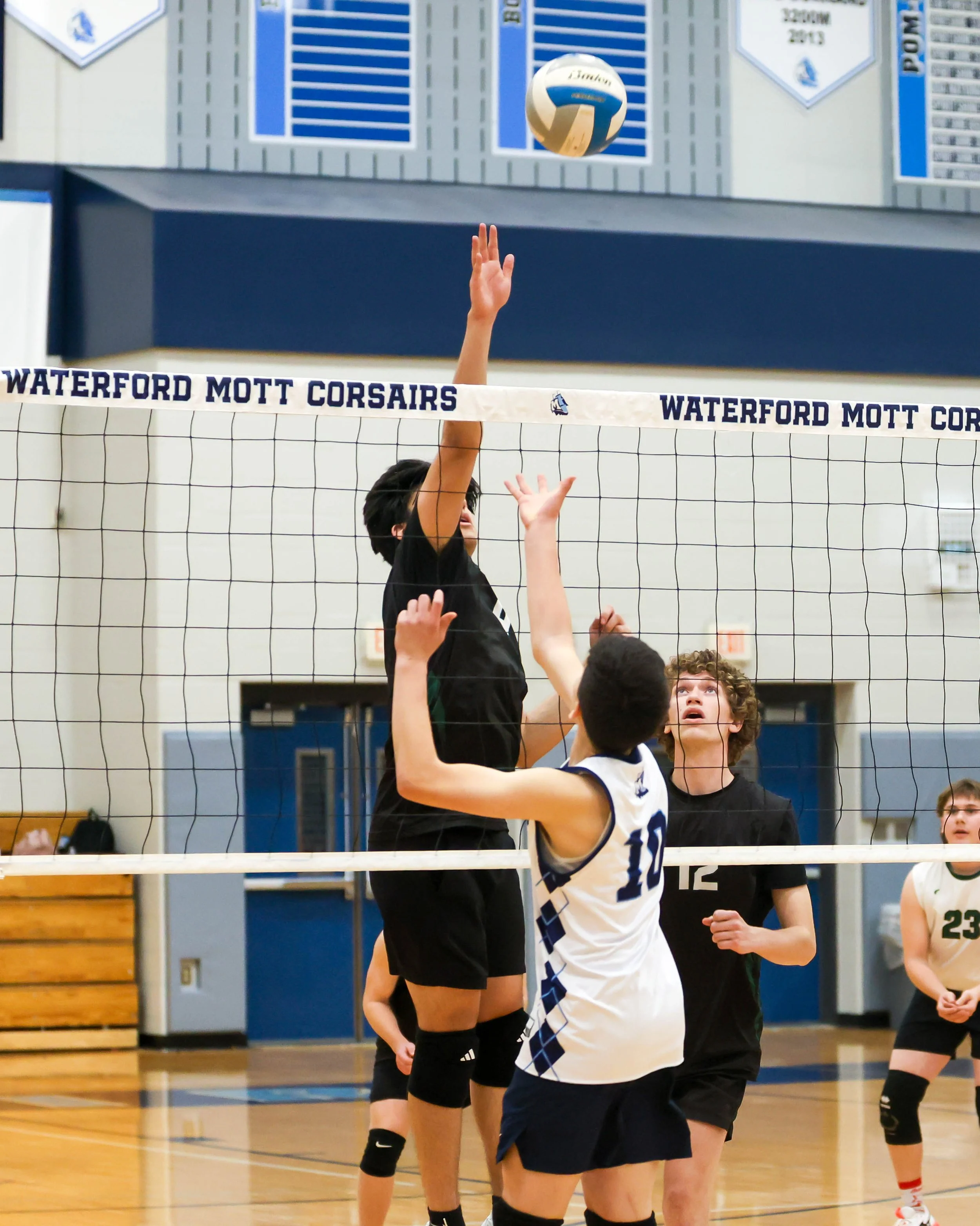 Kettering #6 reaches for the ball