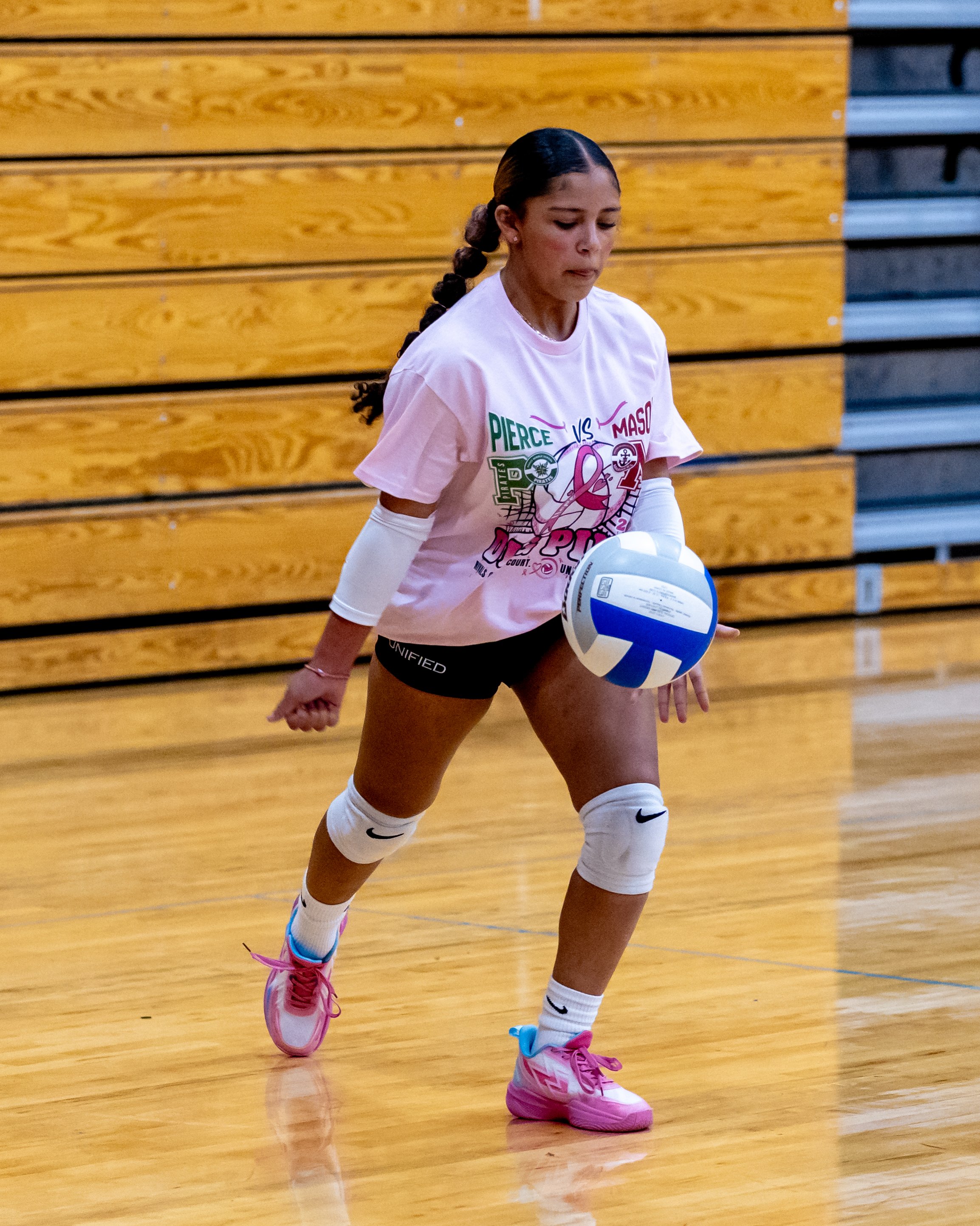 Mason player hits the ball