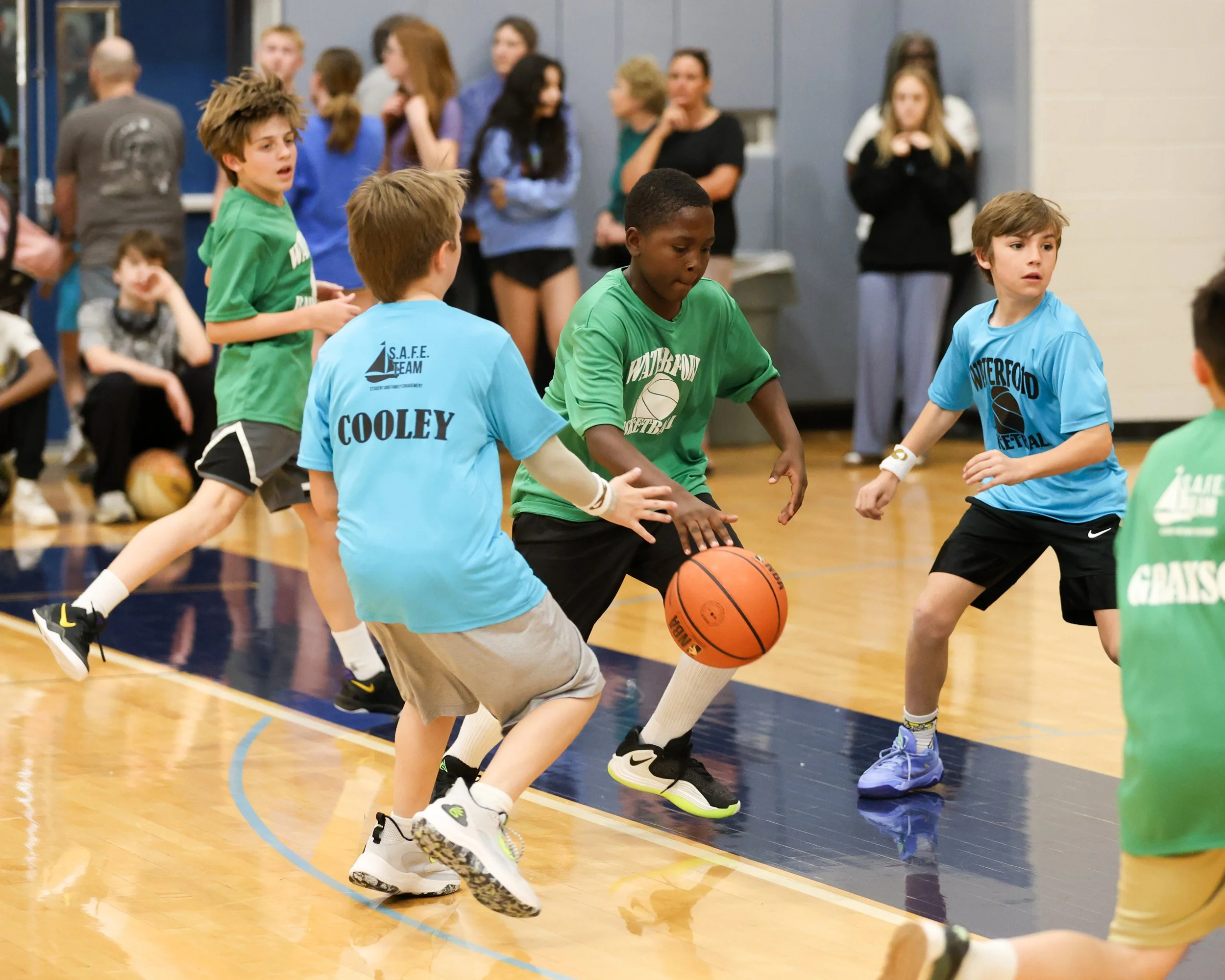 Grayson boy dribbles past Cooley boys