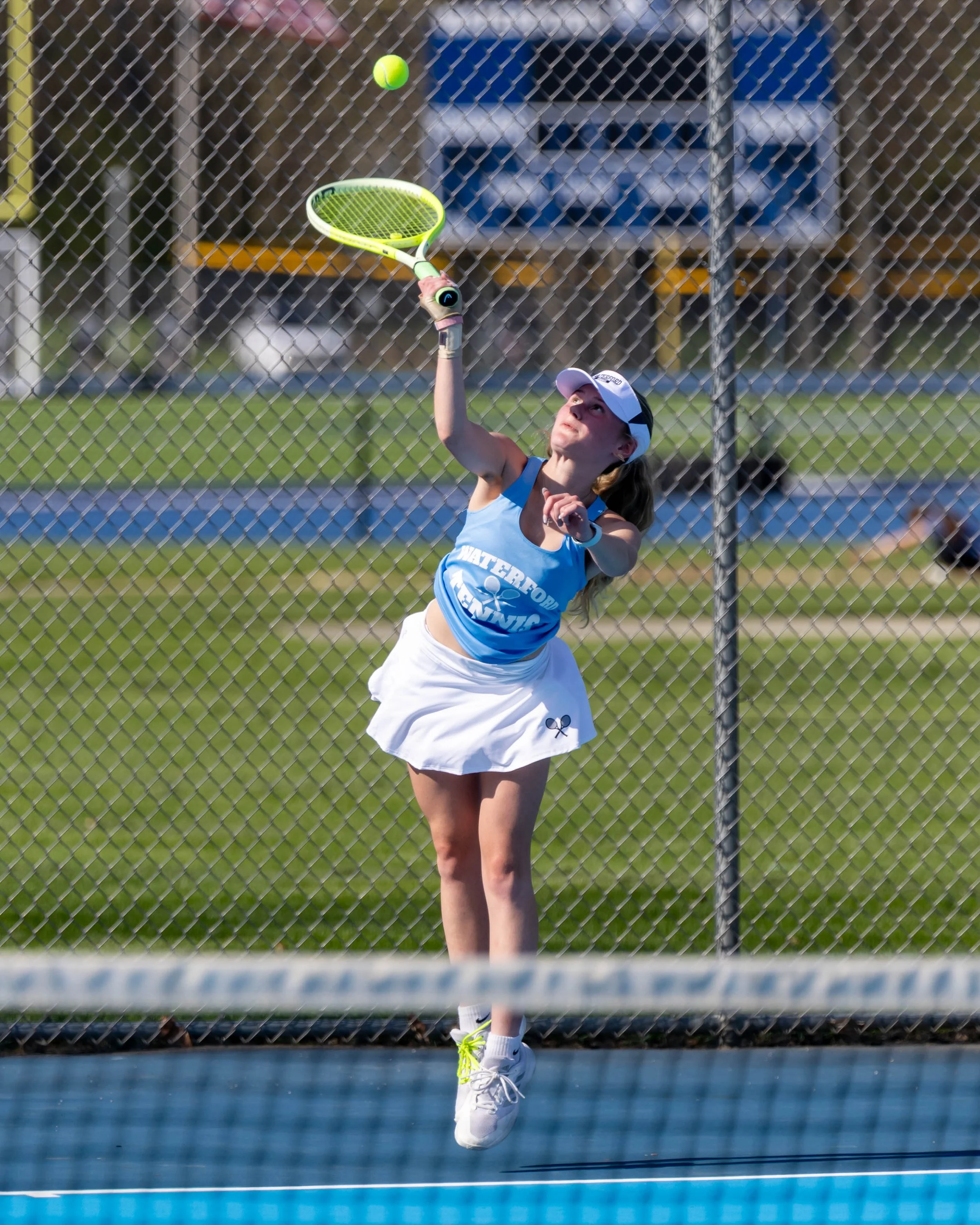 Waterford United player serves the ball