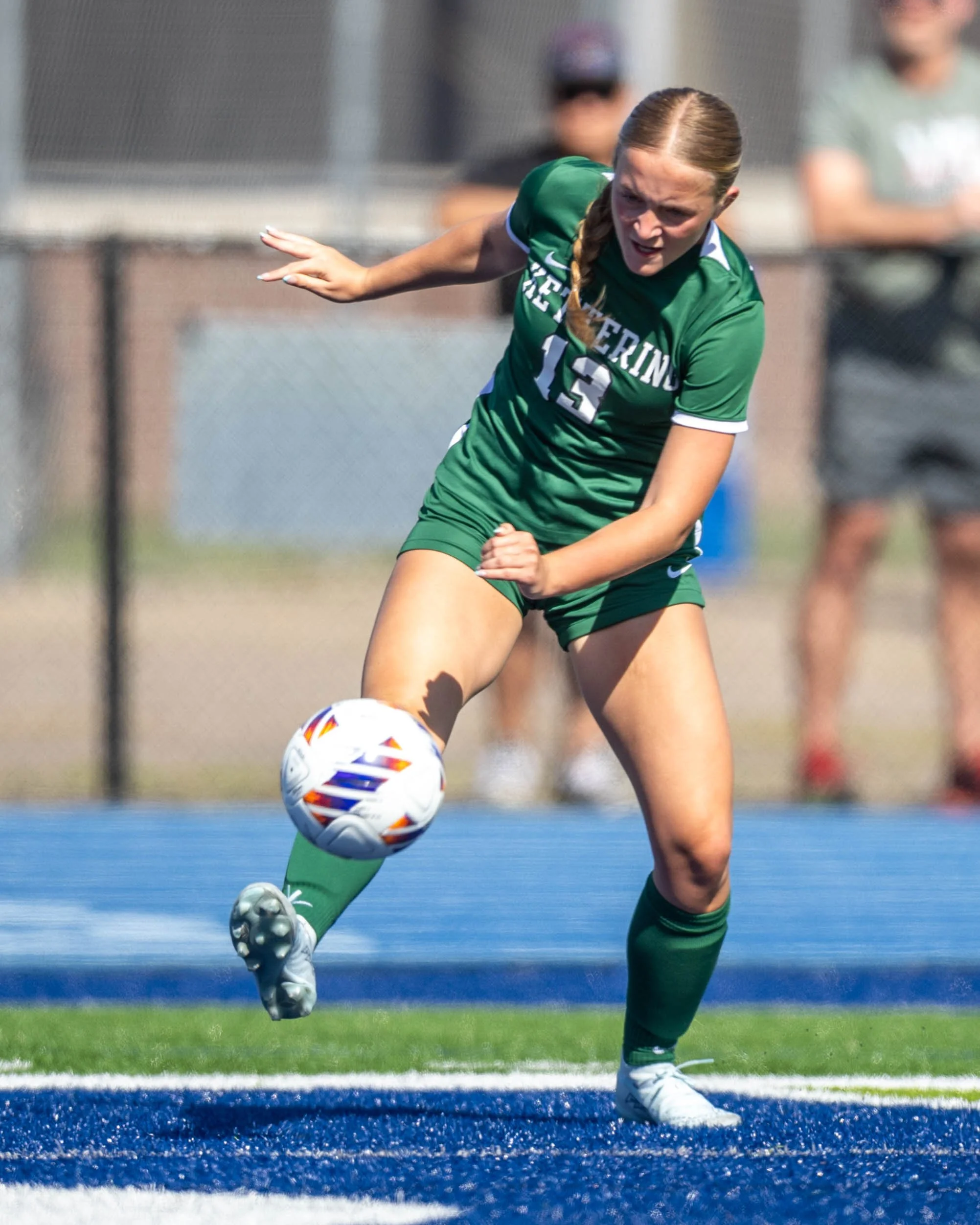 #13 kicks the ball