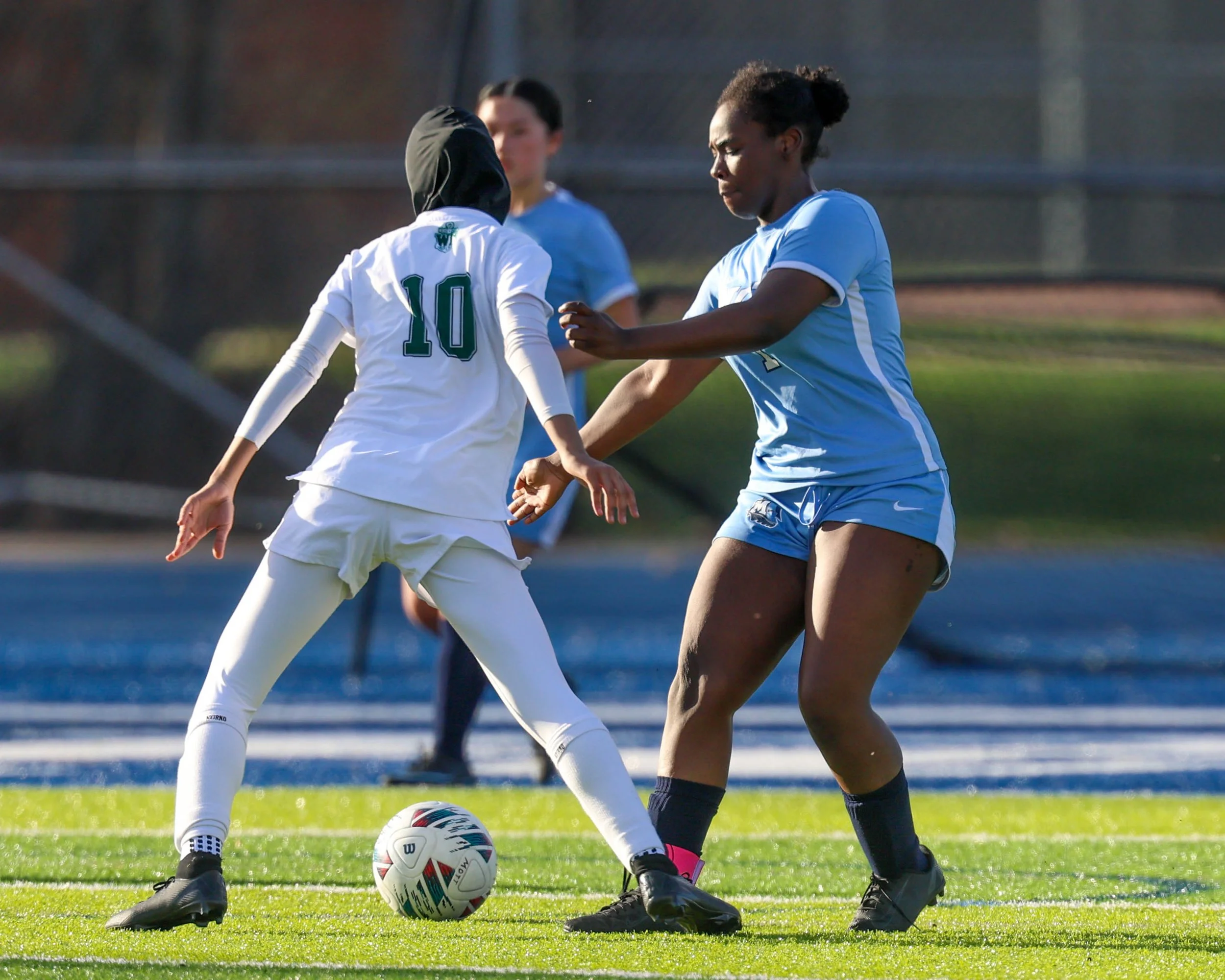 #1 battles for the ball