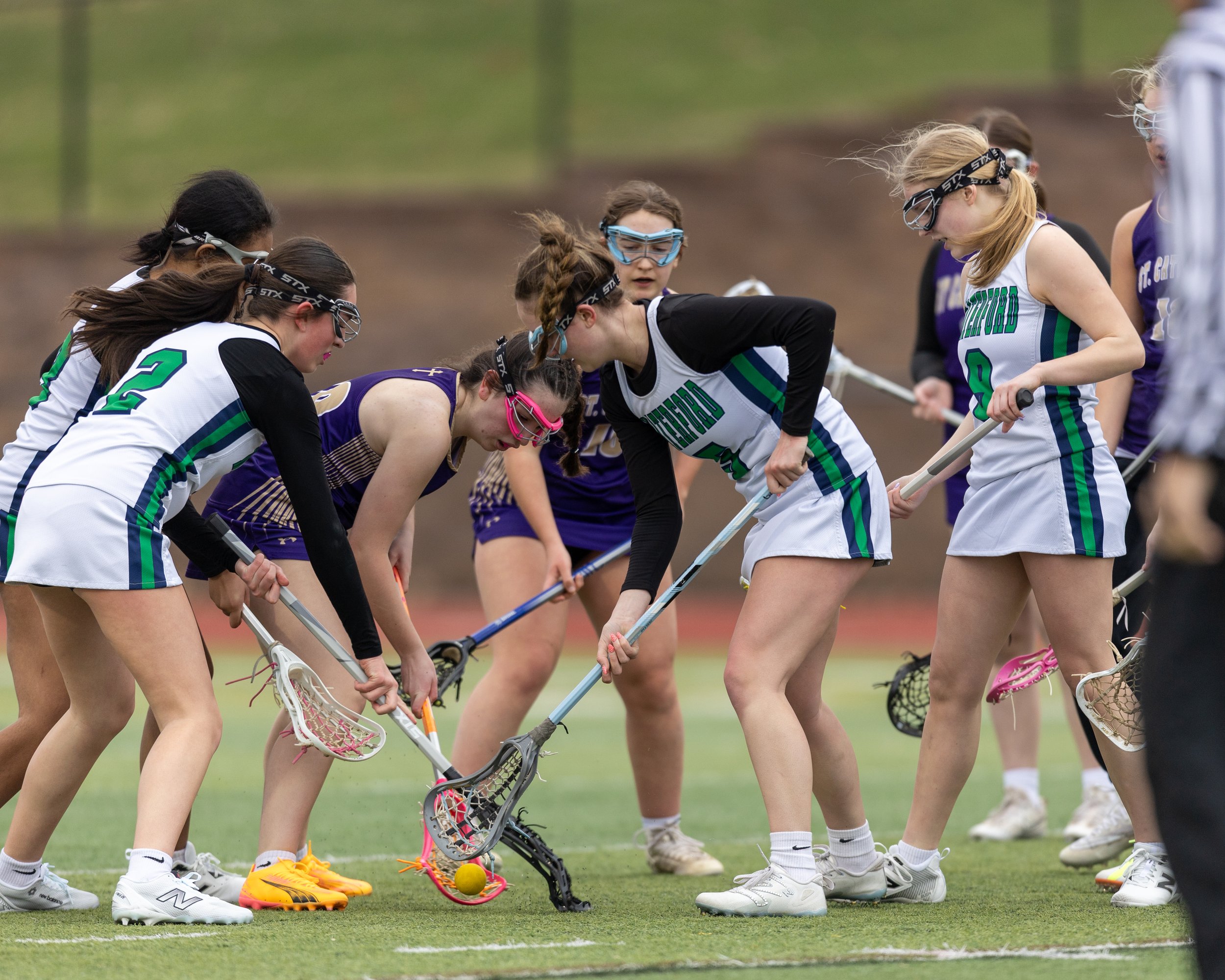 A group of United and St. Catherine fight for the ball