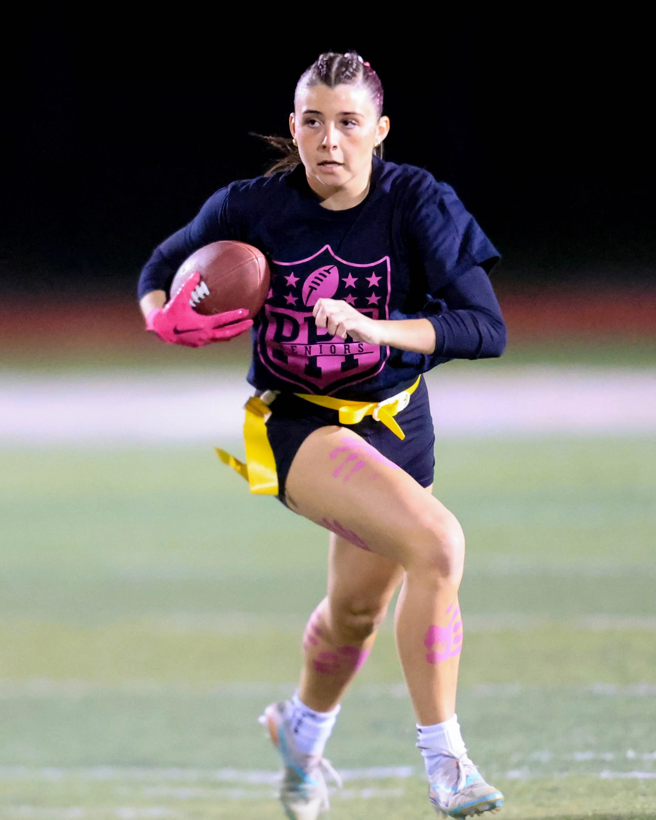 Senior running wth the ball