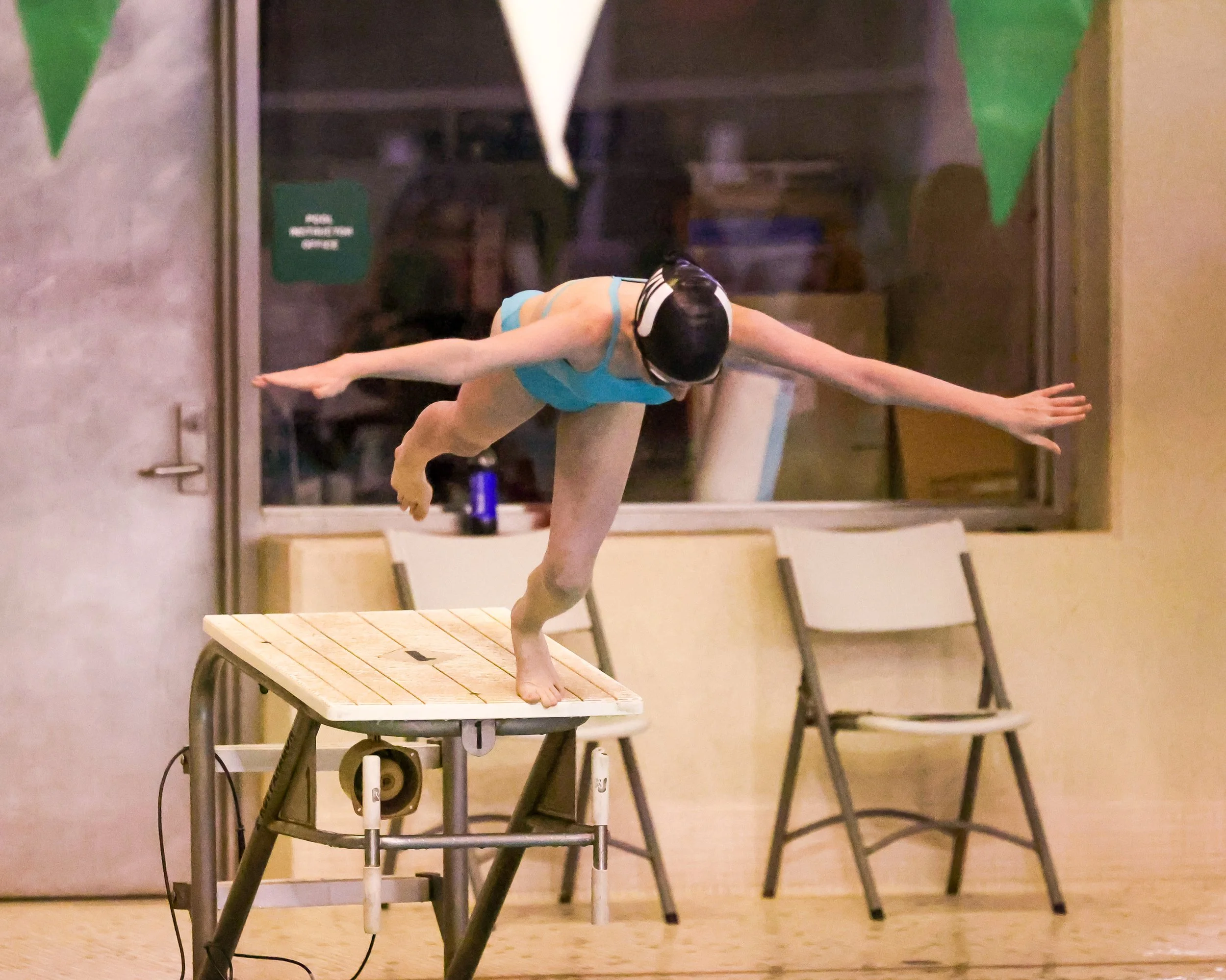WU swimmer starting the 100 Yard Freestyle 