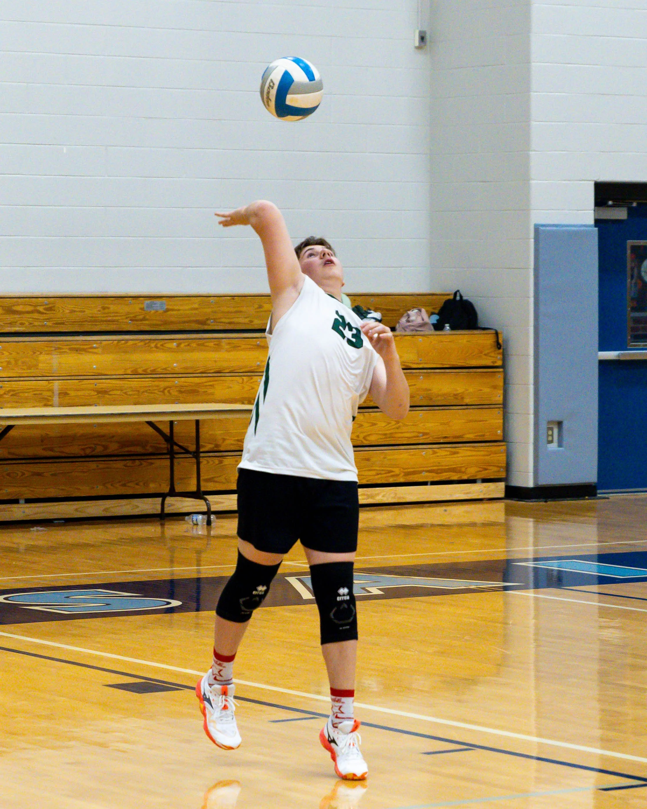 Kettering #23 serves the ball