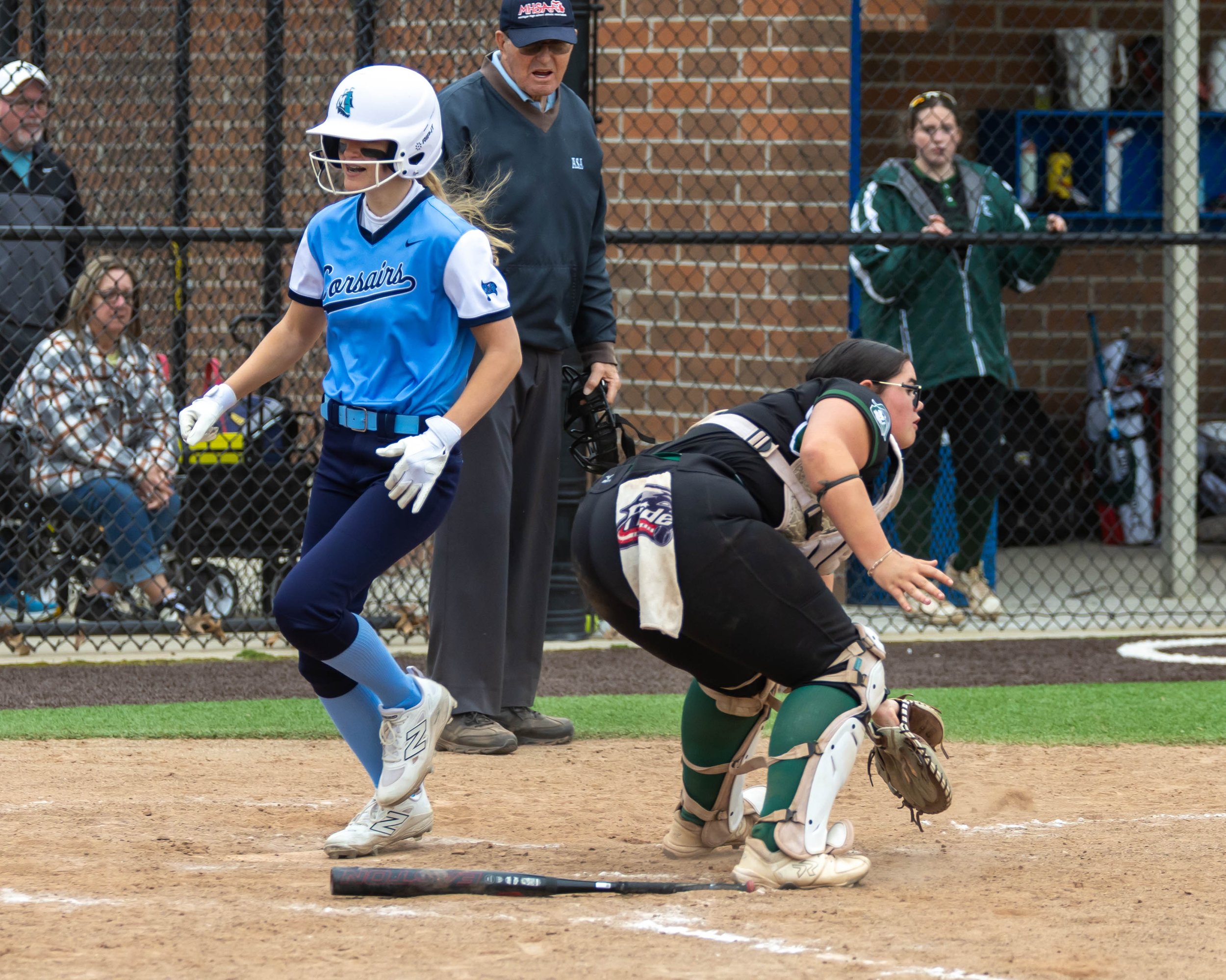 Mott player crosses the plate for a run scored