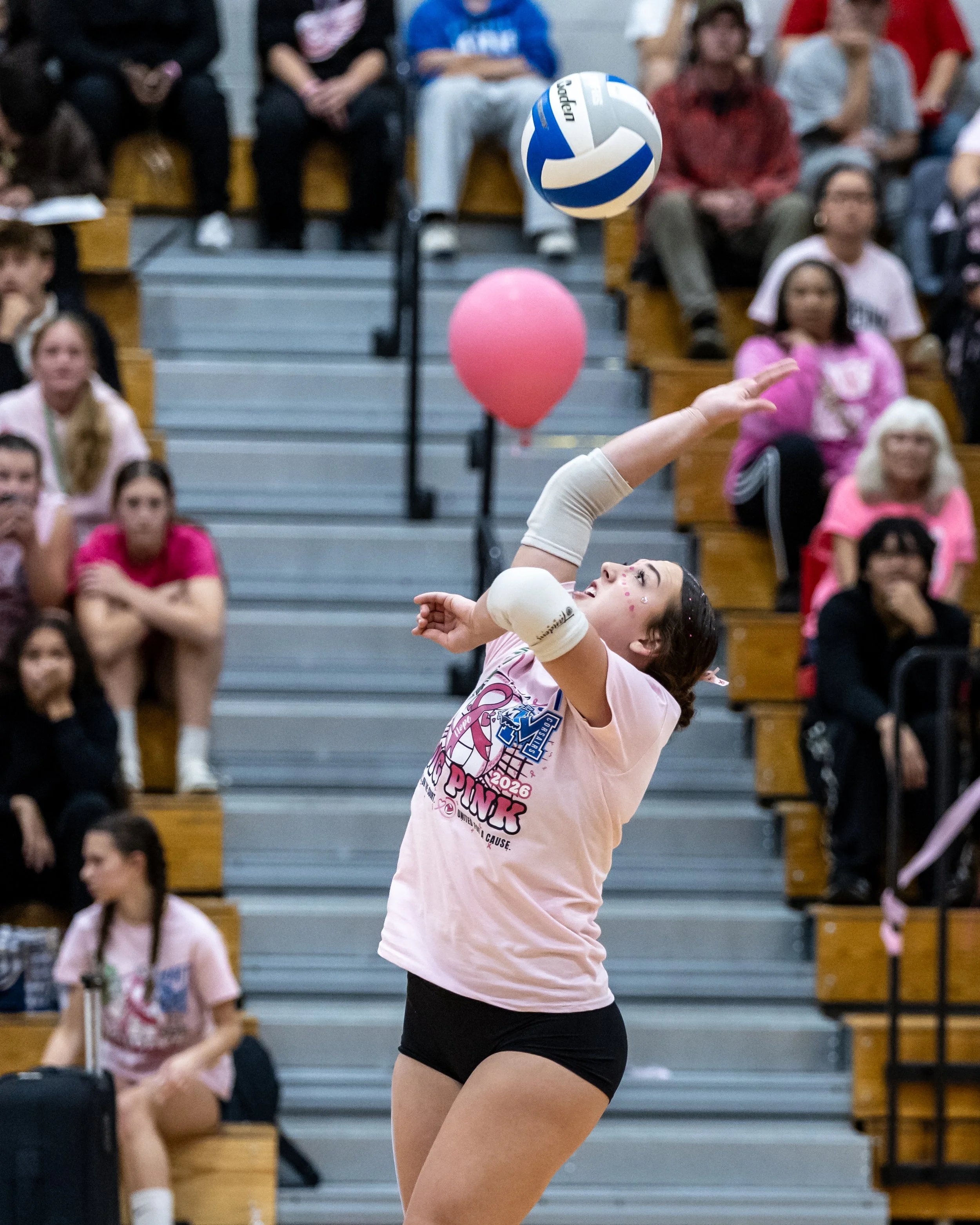 Mott player serves the ball