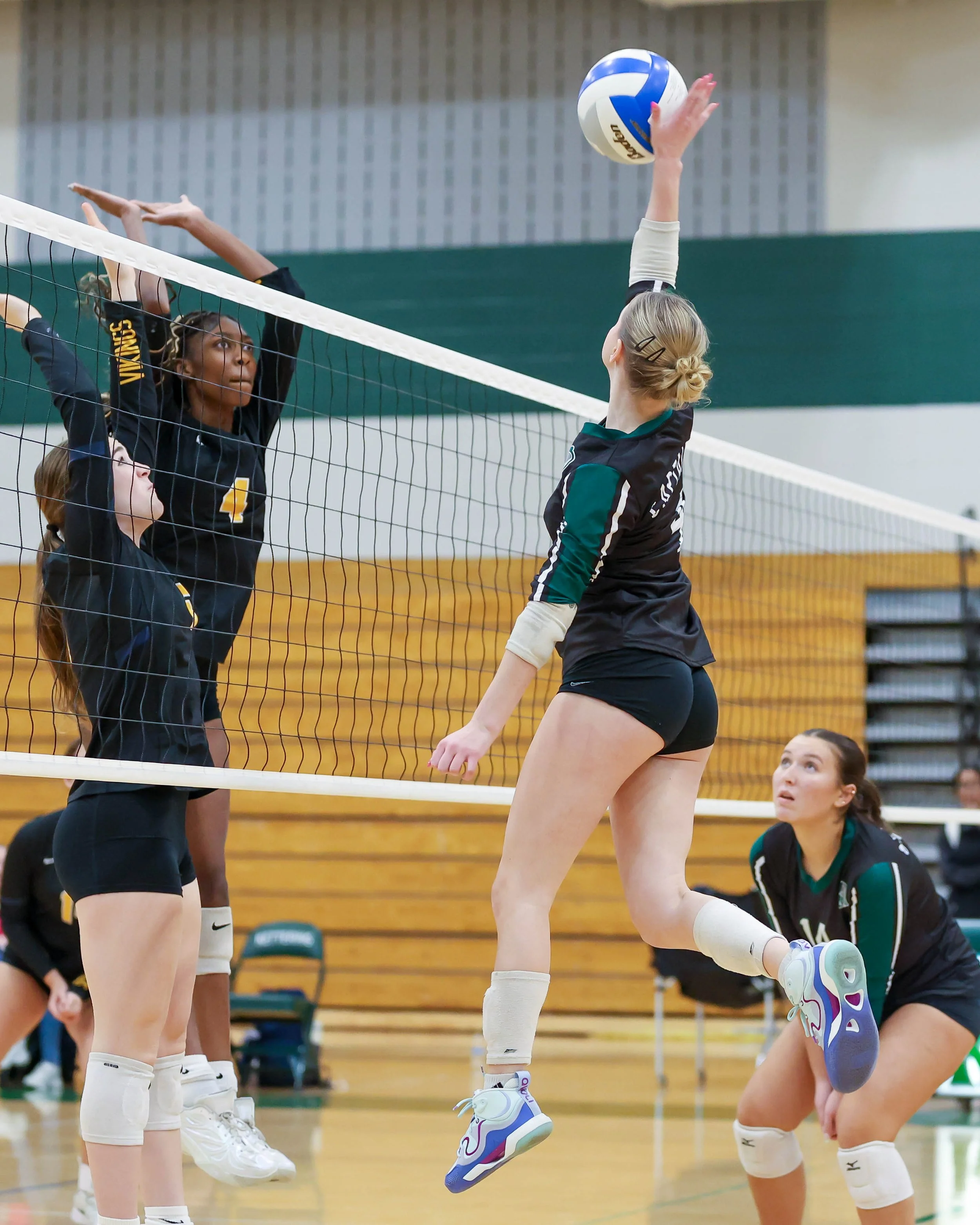 Kettering #4 spikes the ball