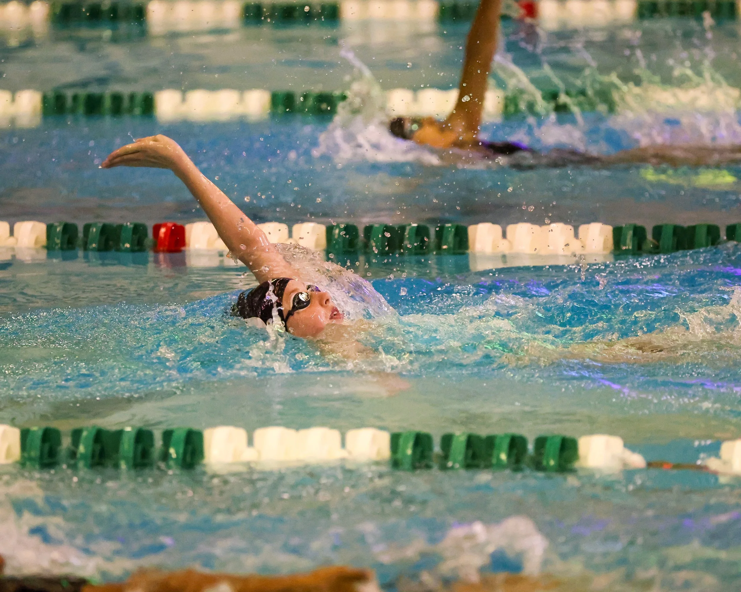WU swimmer doing the backstroke