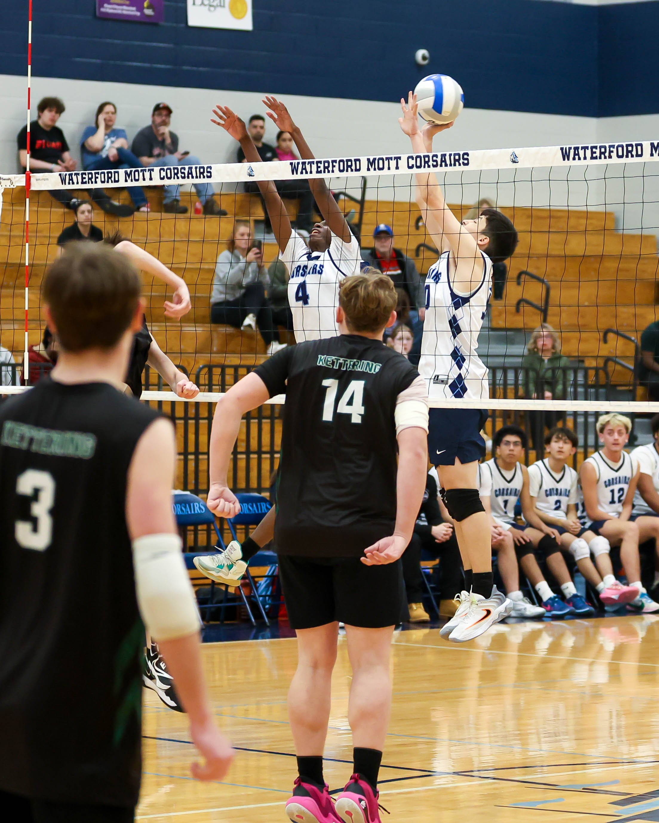 Mott #10 blocks the ball