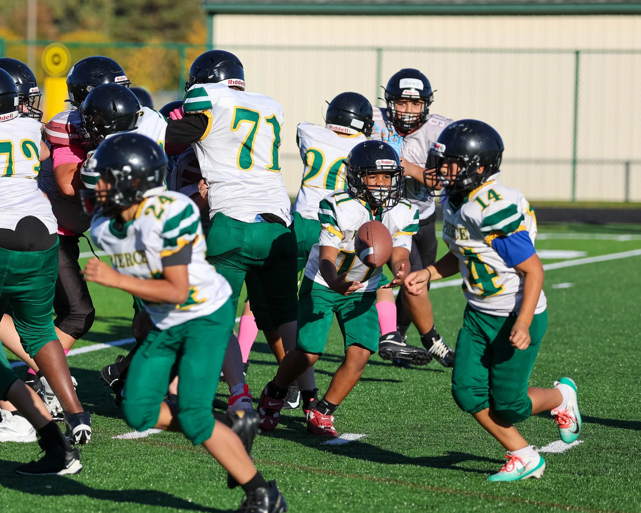 Pierce #11 pitches the ball to Pierce #14