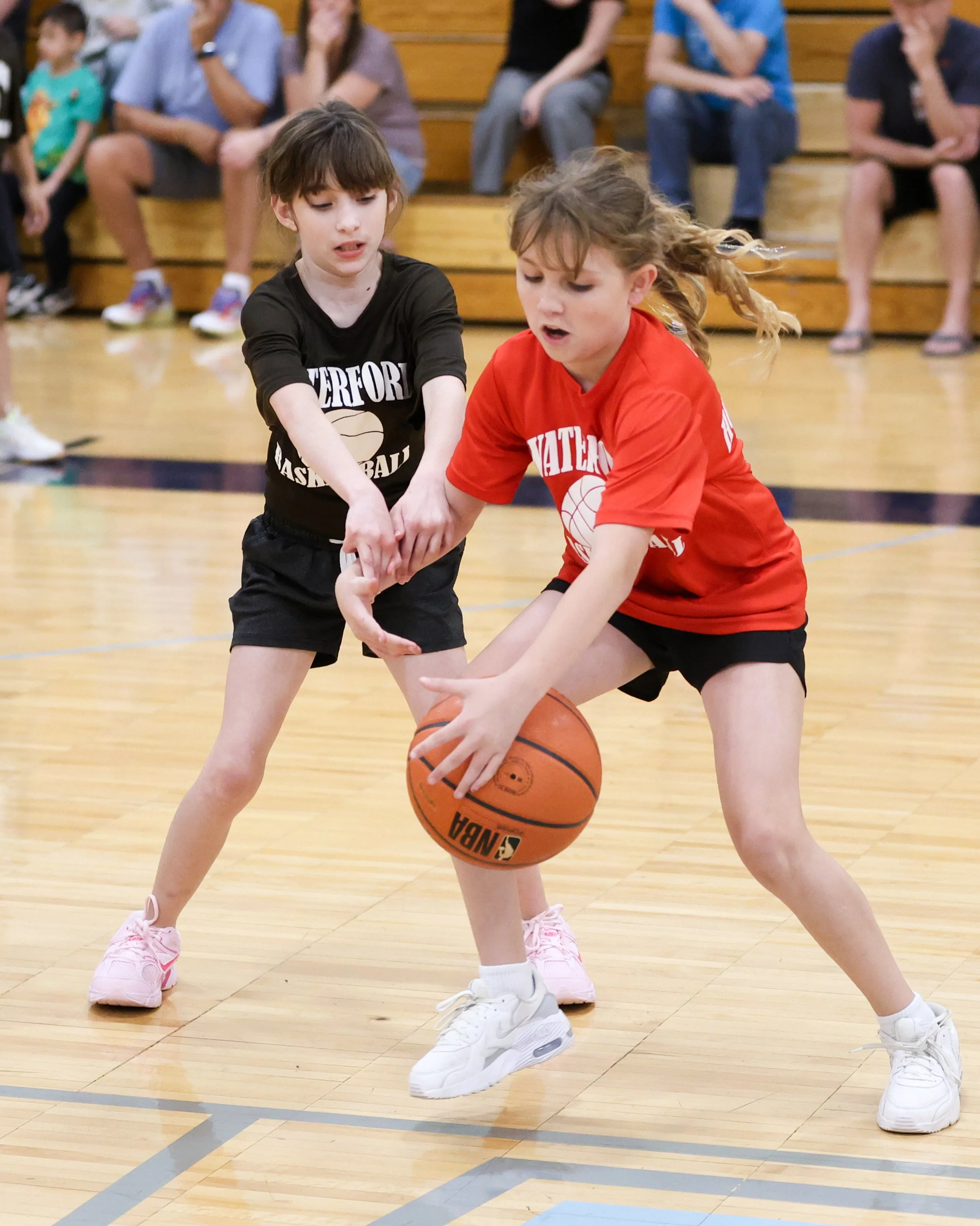 Houghton girl dribbles the ball with Haviland girl guarding her