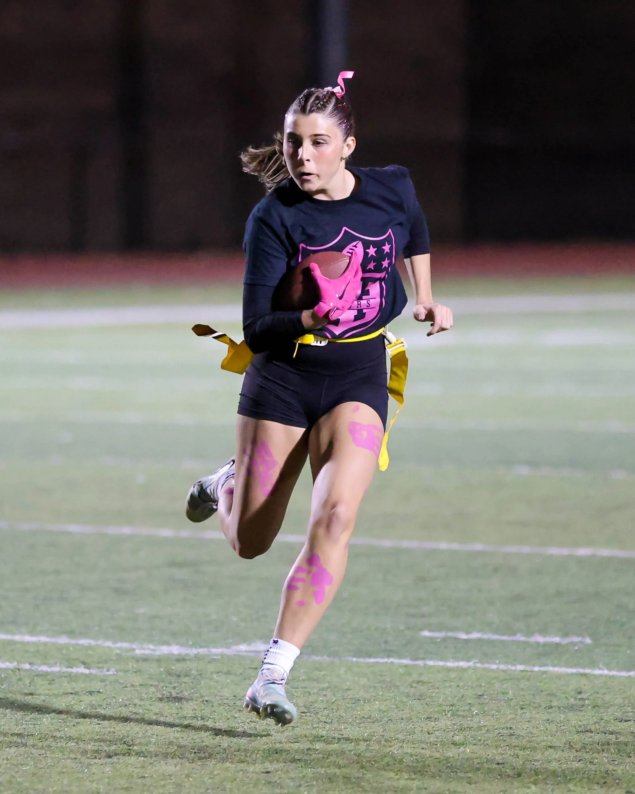 Senior running with the ball