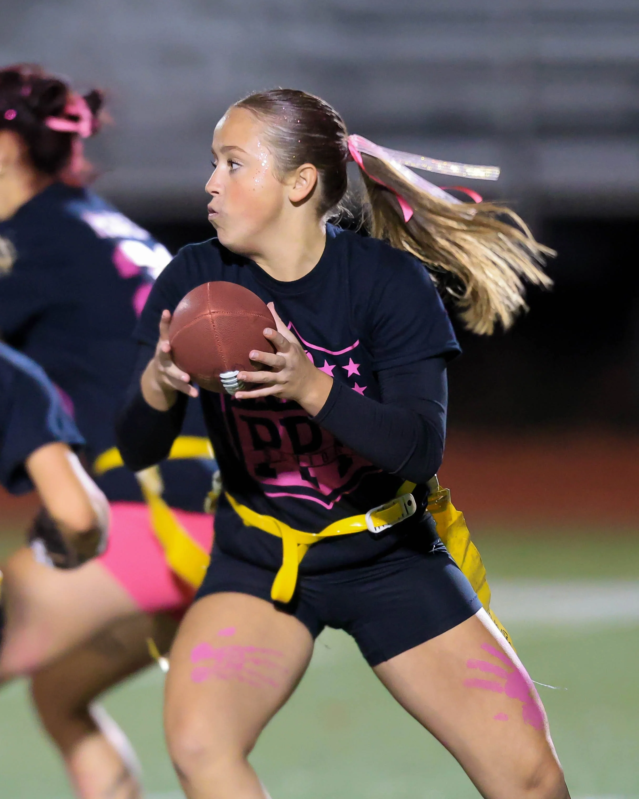 Senior quarterback hands off the ball