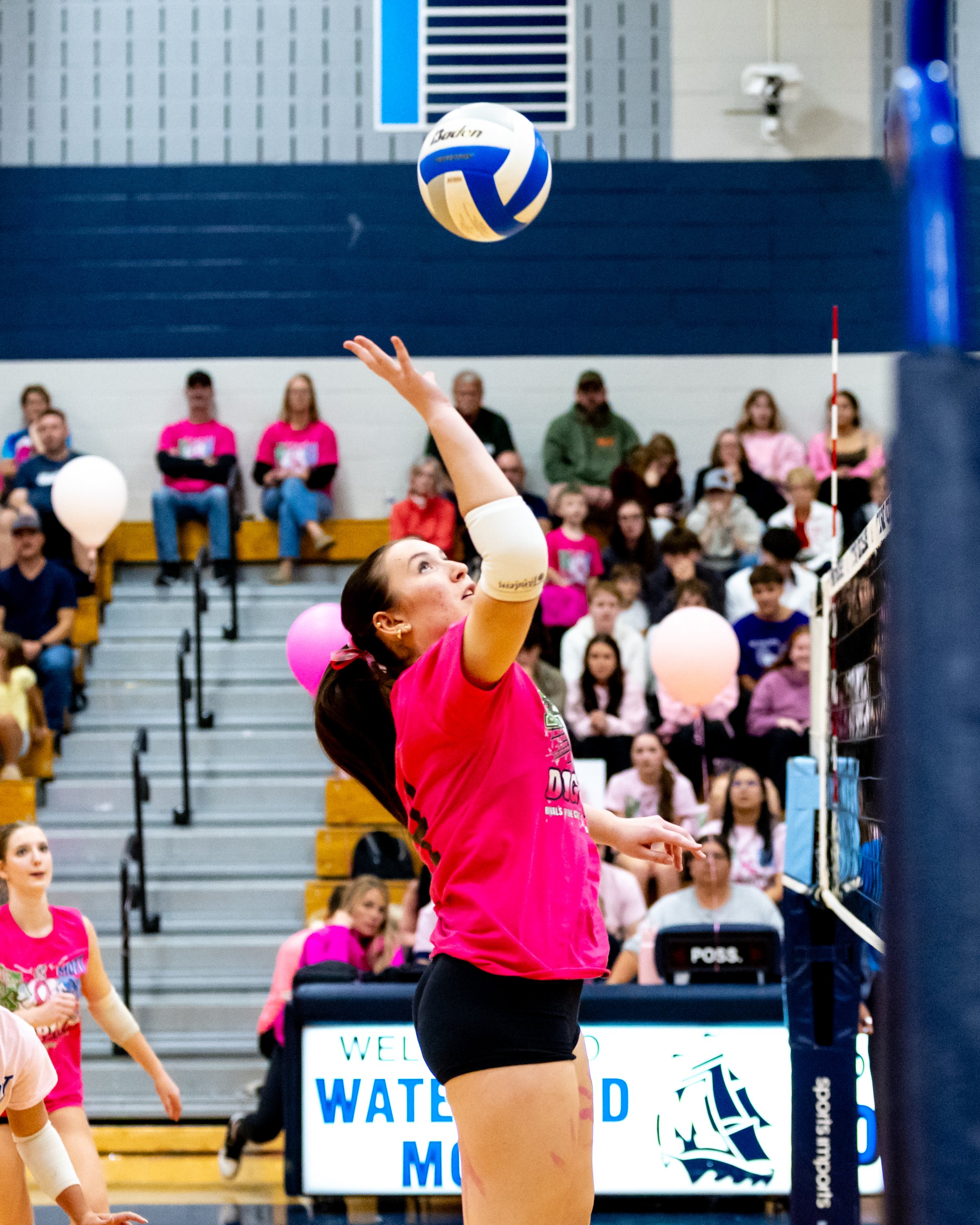 Kettering player hits the ball