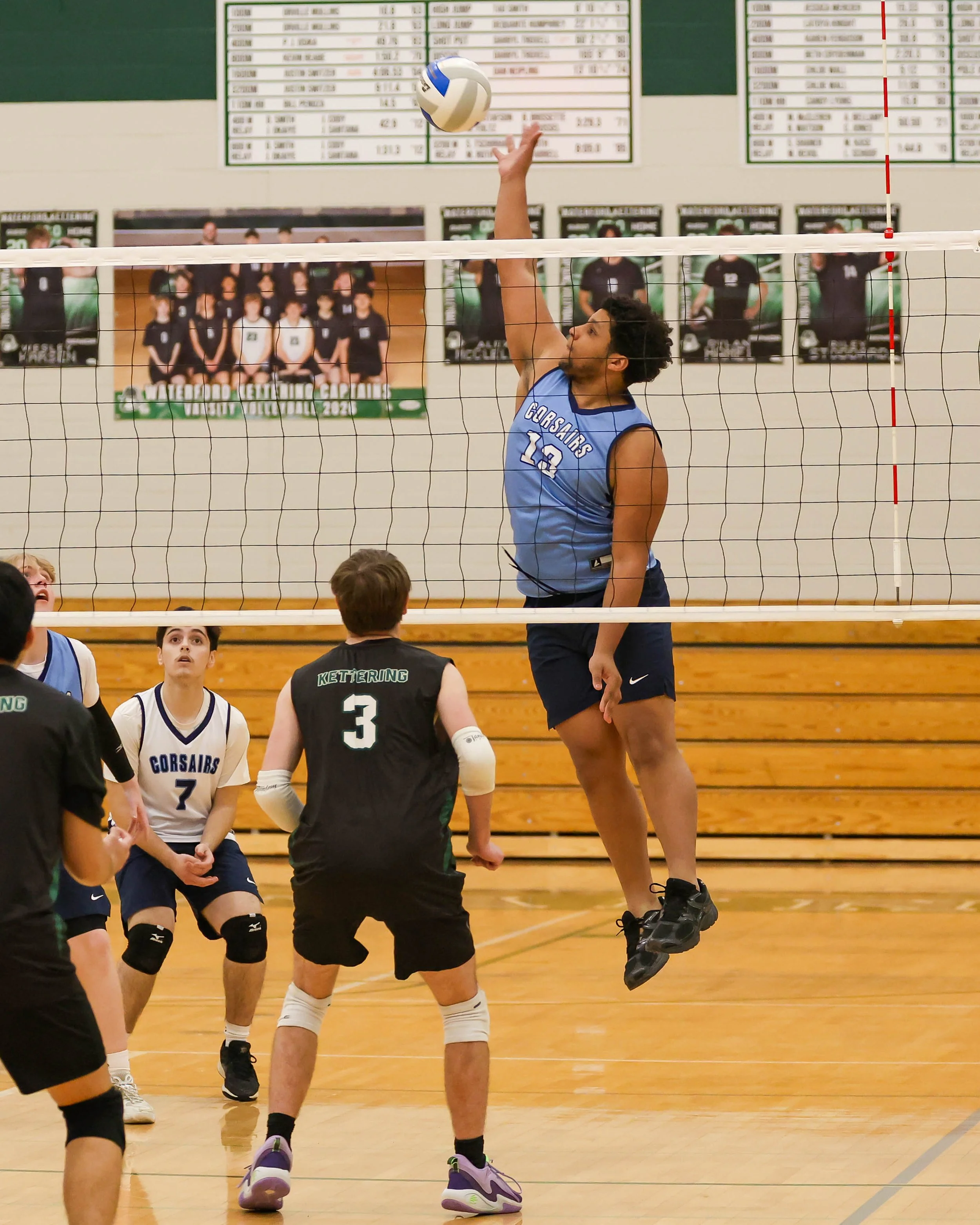 Mott #13 spikes the ball