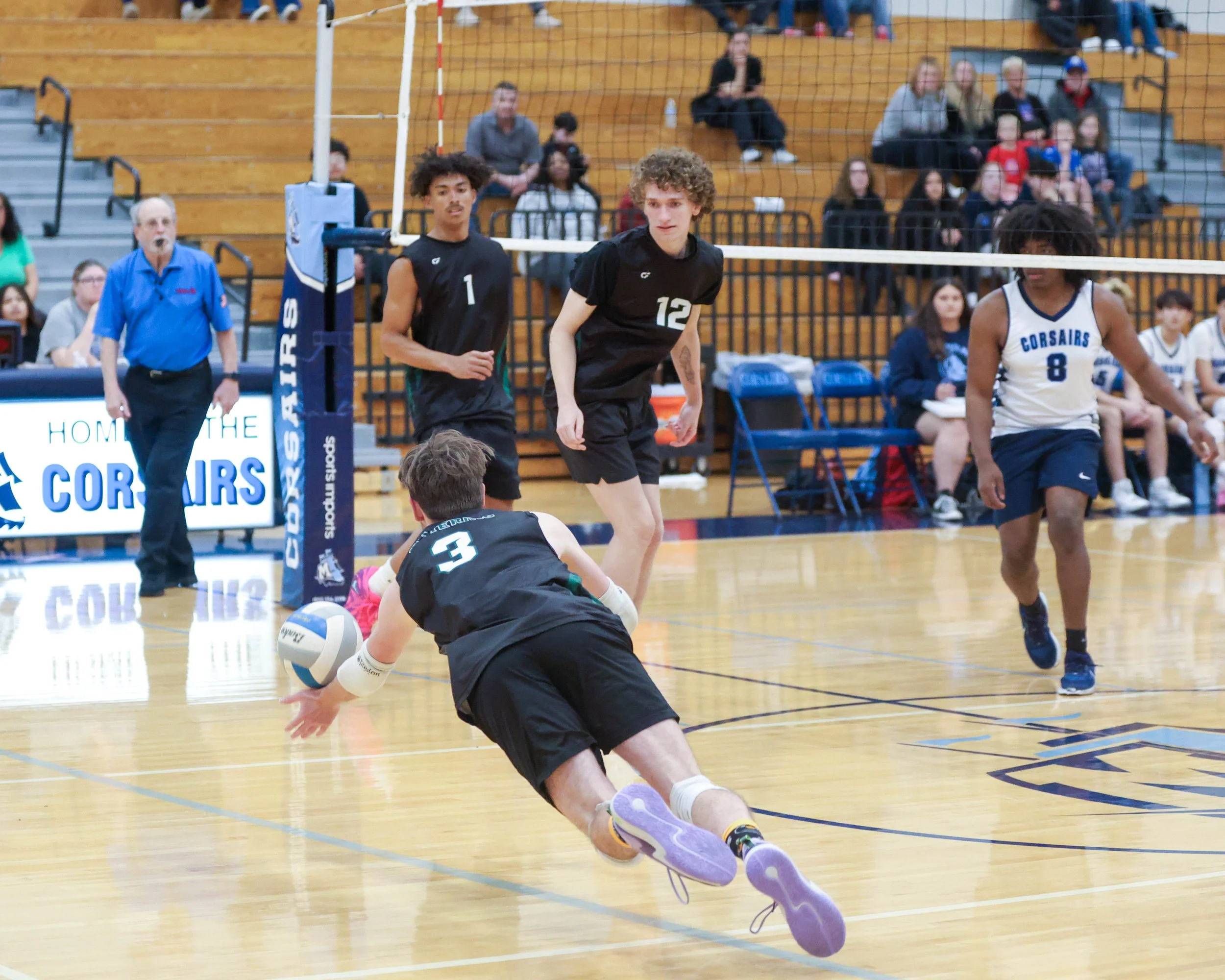 Kettering #3 dives for the ball