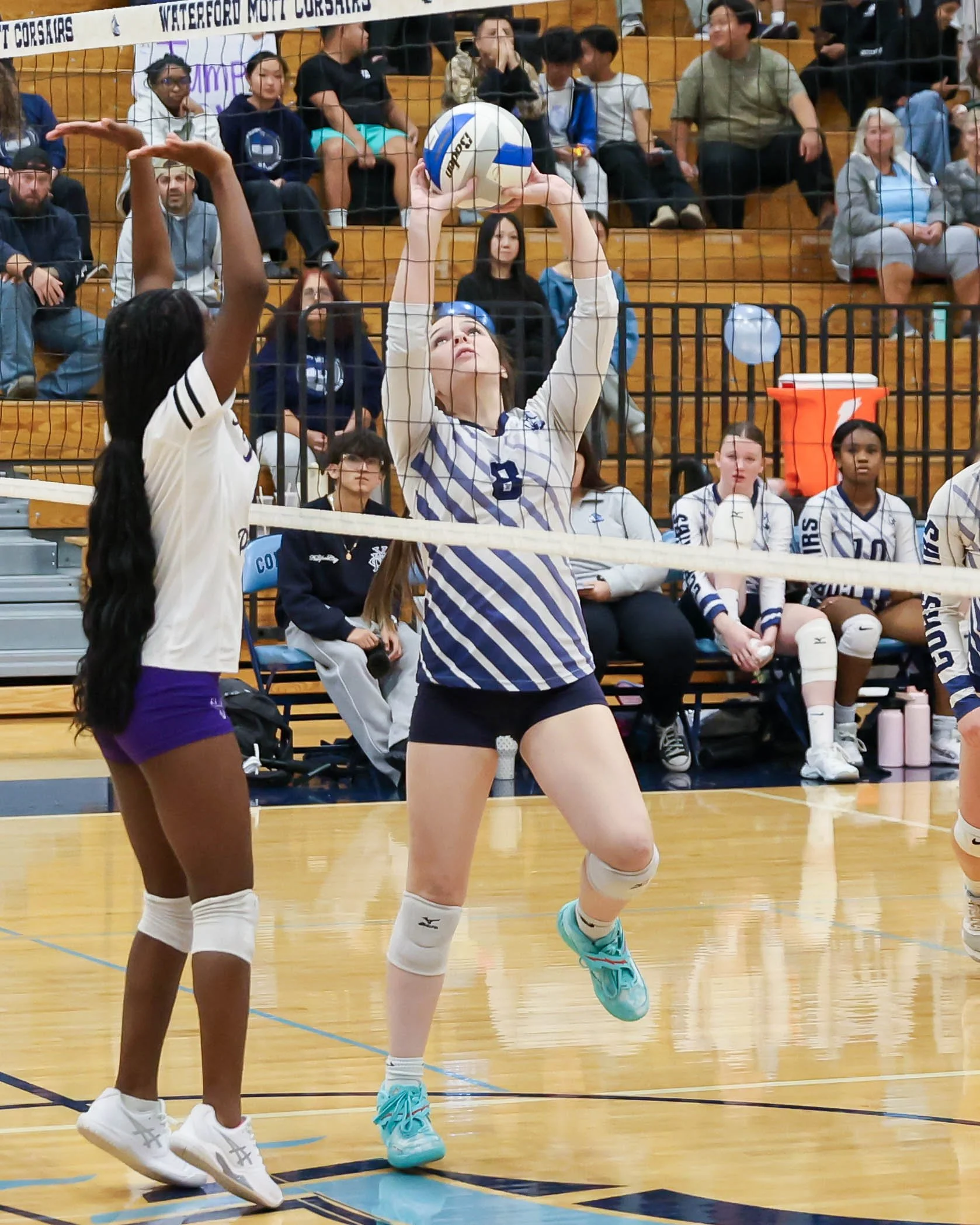 Mott #8 sets the ball