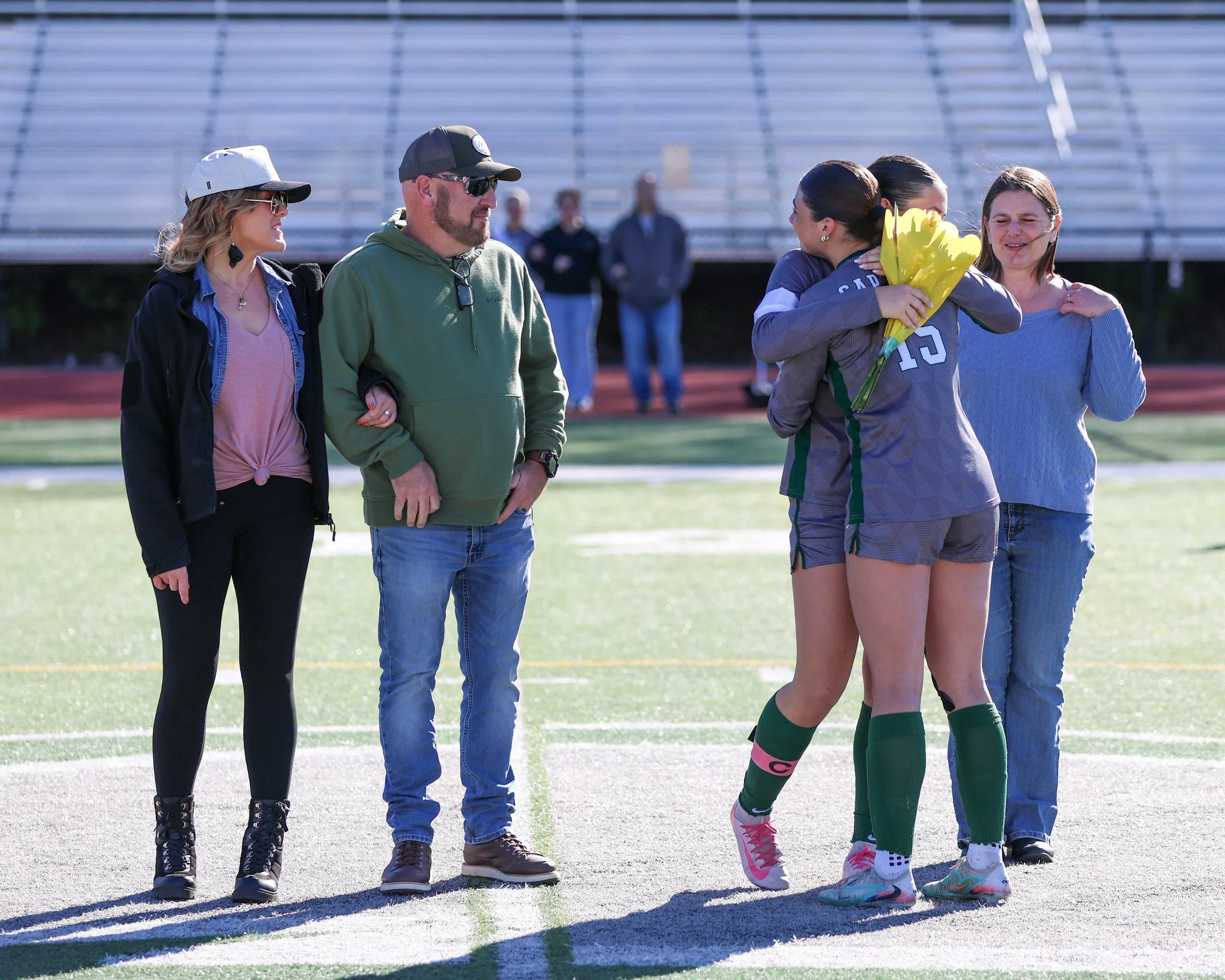 Senior #20 getting a hug #15