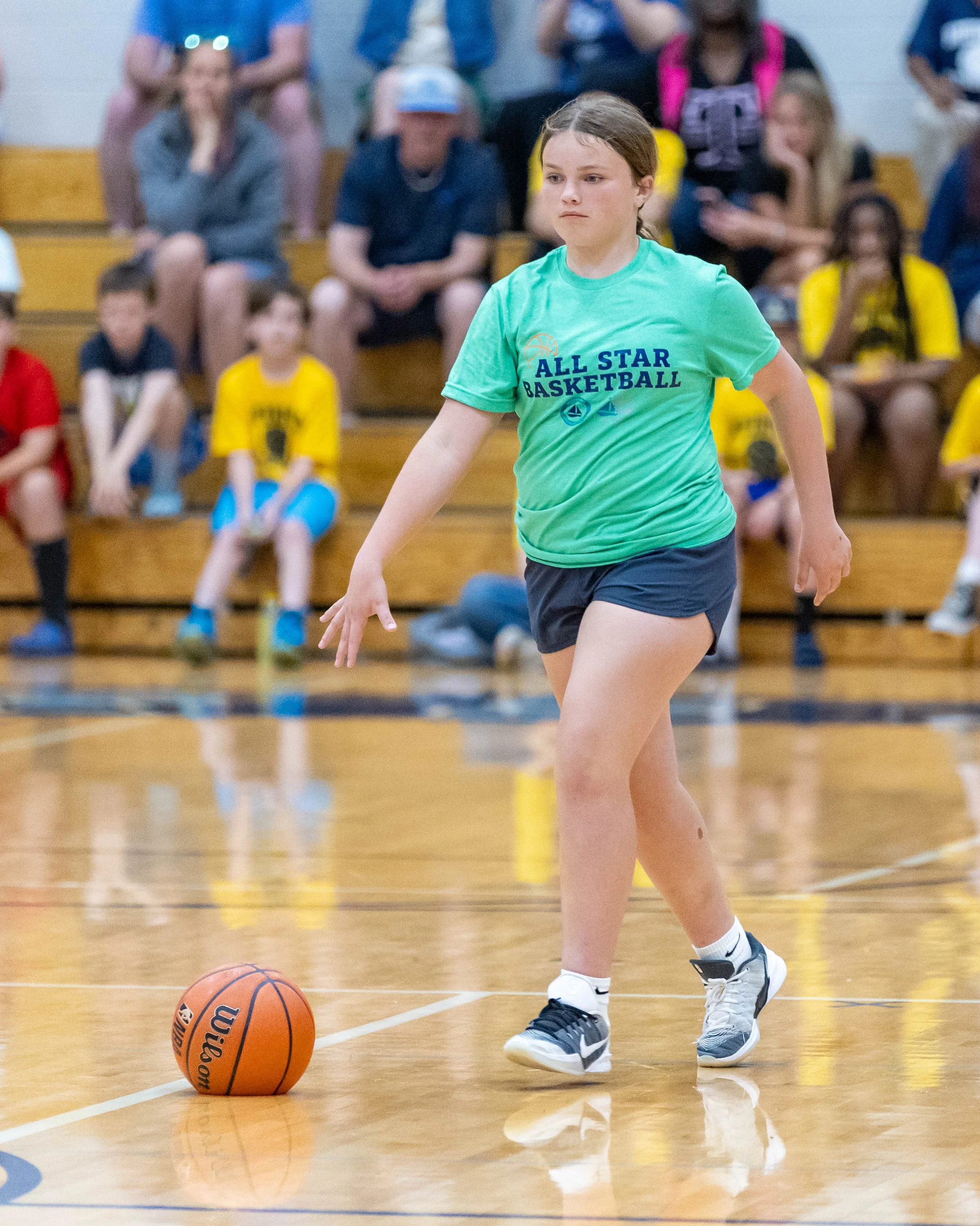 South girl dribbles the ball