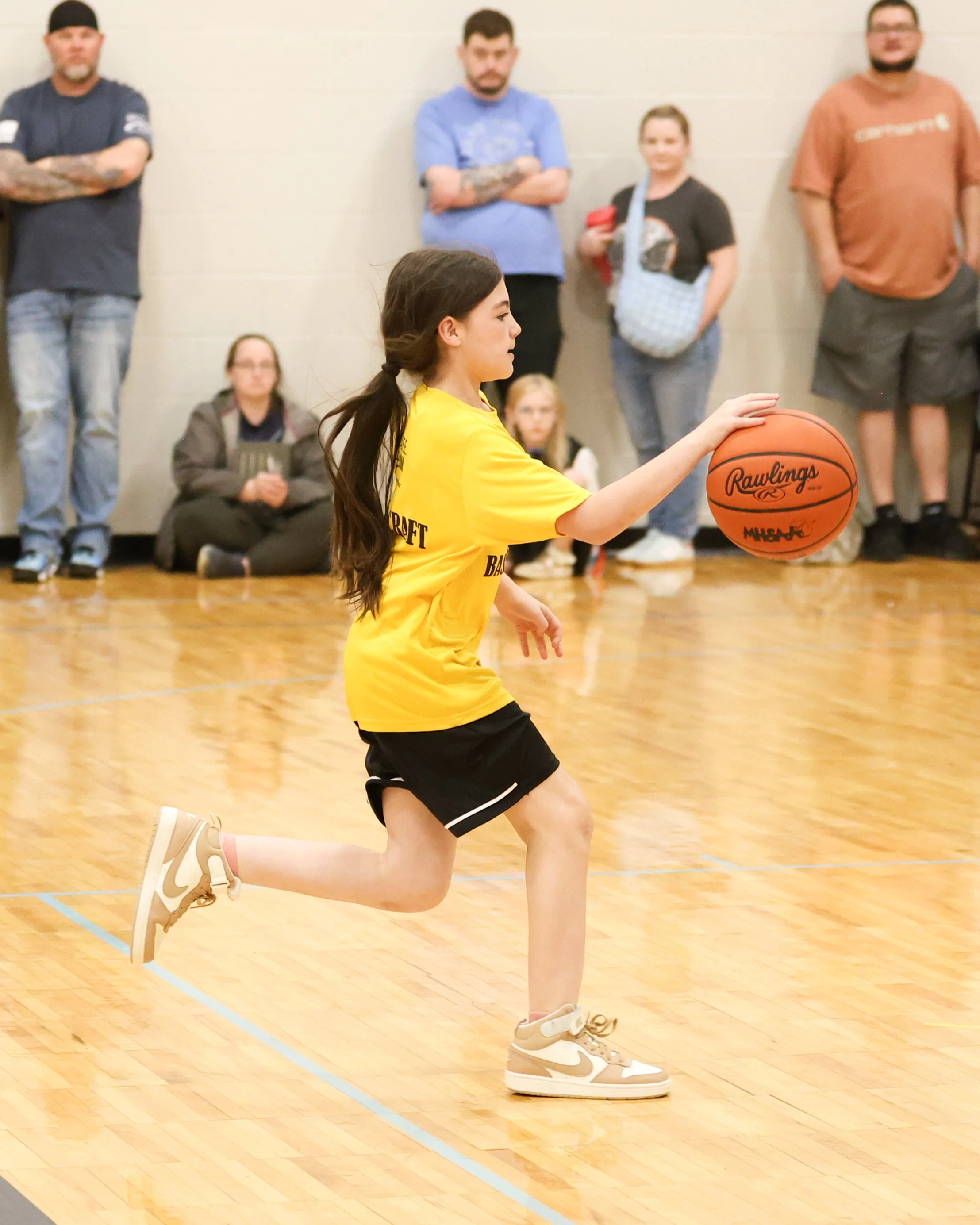 Schoolcraft girl dribbles the ball
